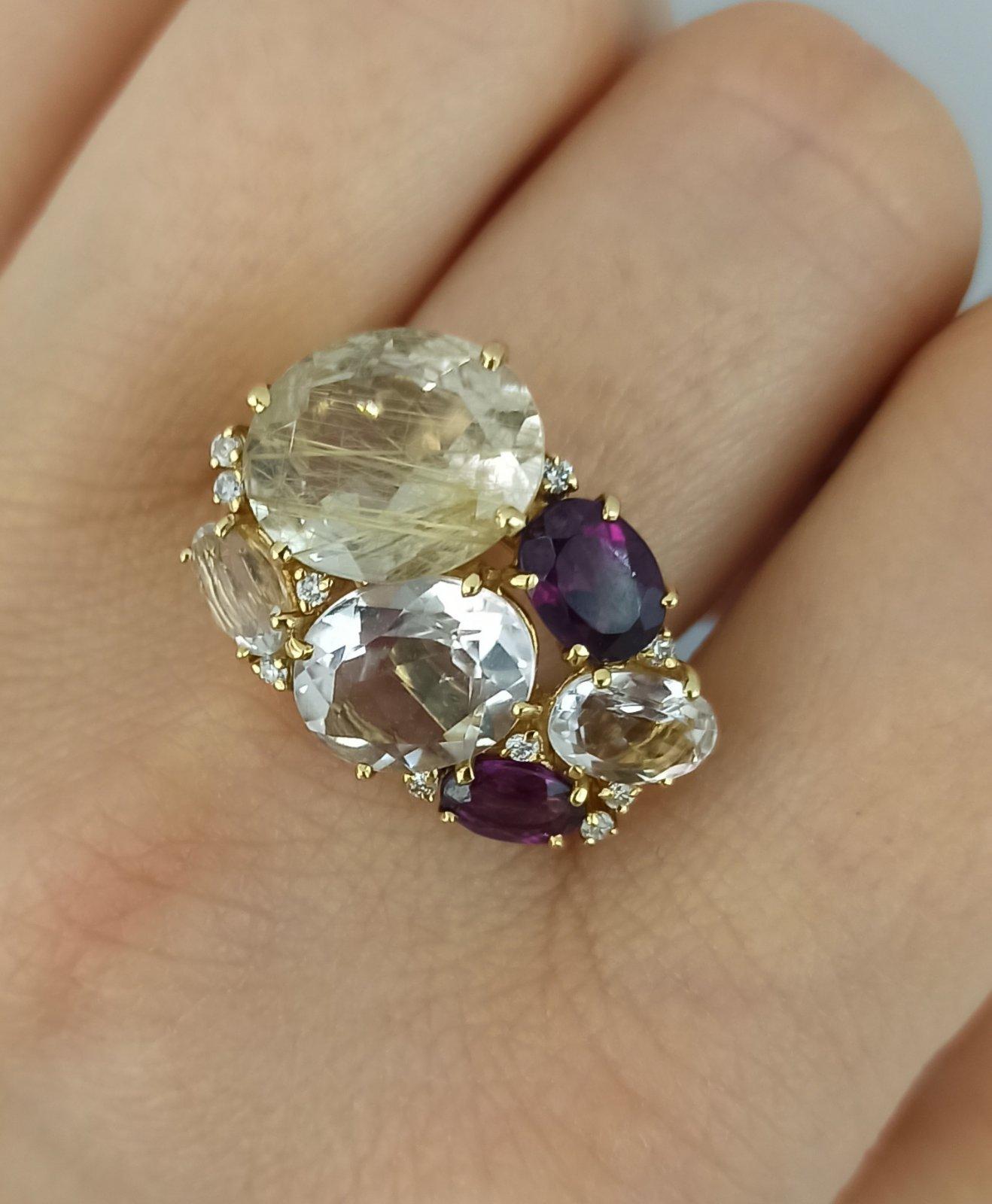Ring Yellow Gold 18K (Matching Earrings Available) 
Diamond 10-Round 57-0,1-5/6A 
Quartz 1-Oval-4,1 3/1A 
Garnet 2-Oval-1,1 2/3A 
Quartz 2-Oval-1,1 3/1A 
Quartz 1-Oval-4,1 3/1A
Weight 6,79 gram
Size 17,2

With a heritage of ancient fine Swiss
