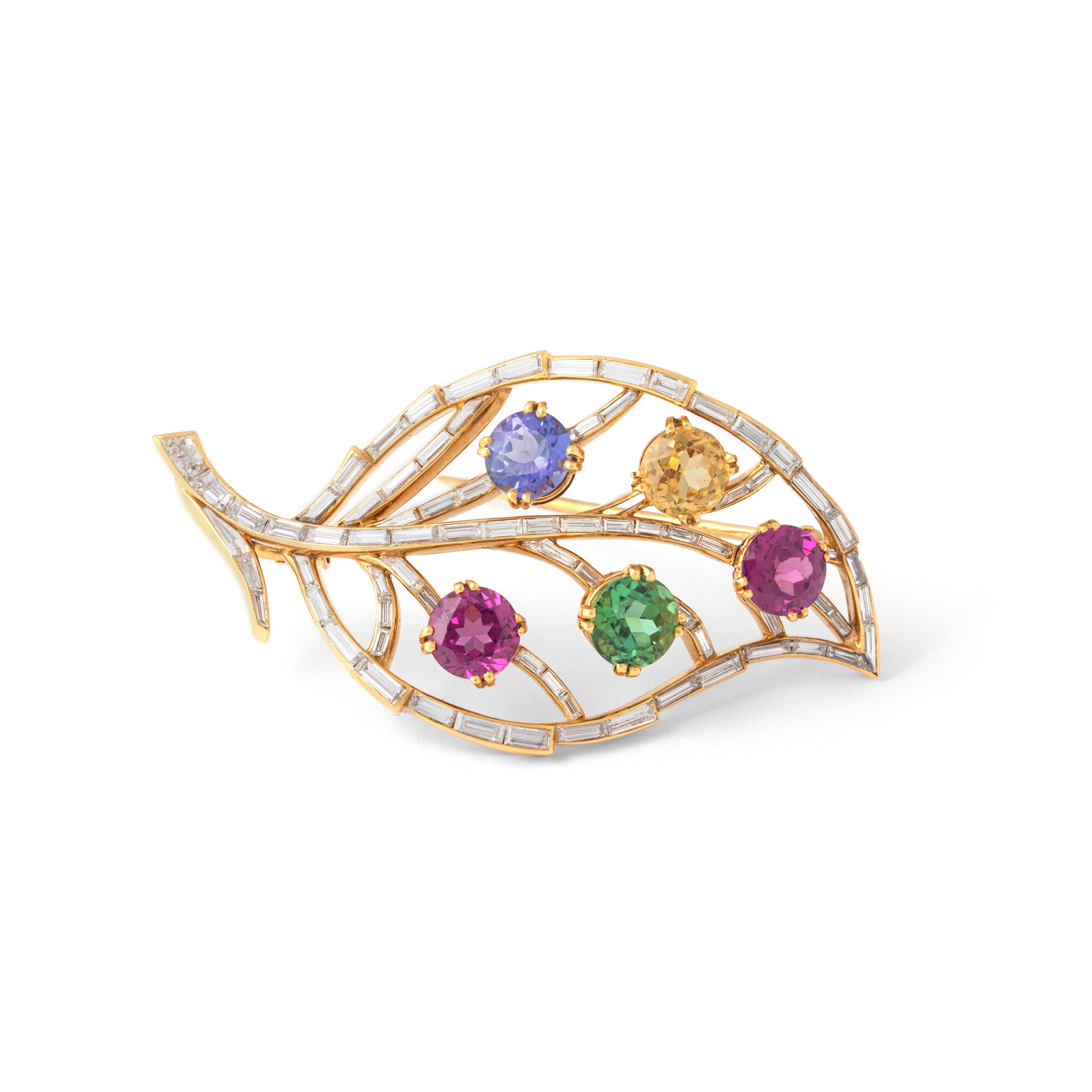 Diamond and gemstones set on gold and platinum Brooch representing a leaf.
74 baguette cut diamonds. Total approximately 7.00 carats.
5 gemstones. Total approximately 5.00 carats.

Total length: 6.00 centimeters.
Total weight: 18.62 grams.
Width: