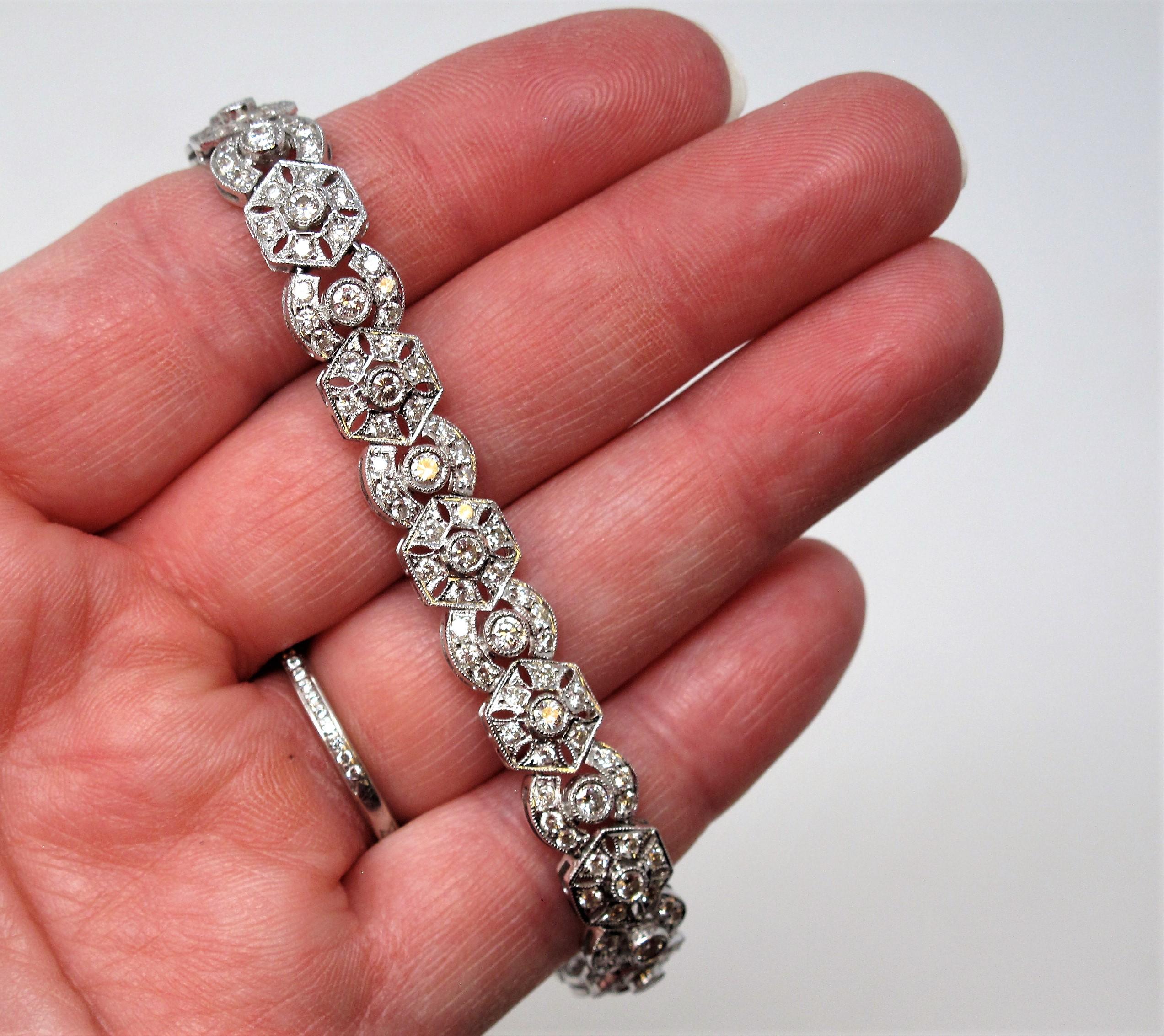 Gorgeous, sparkling diamond bracelet with an elegant twist. The detailed geometric shapes paired with the intricate milgrain detailing adds elevated design and texture to the traditional diamond bracelet. This dazzling piece is sure to impress!