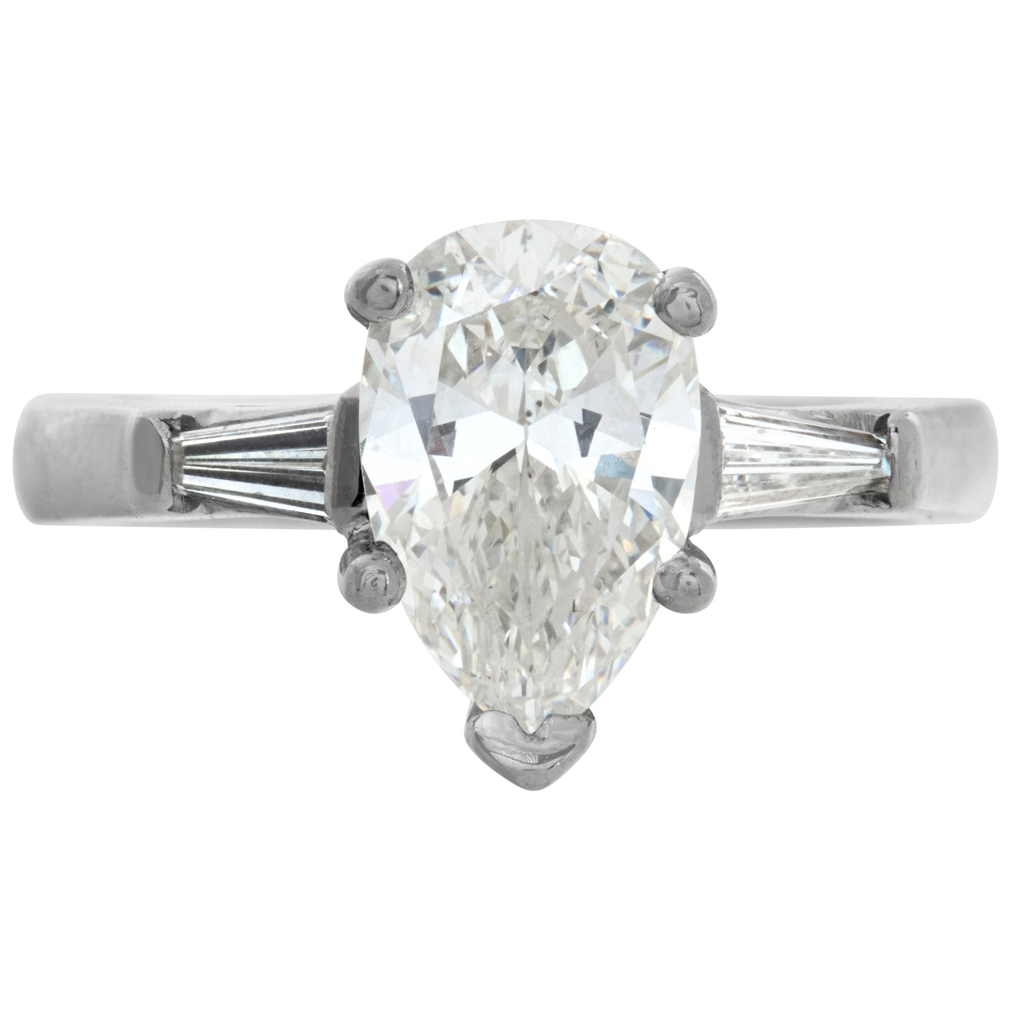 GIA certified Pear Brilliant Cut natural diamond 1.72 ct. J color, SI1 clarity. Platinum setting with tapered baguette diamond accents on each side. Size 6.

This GIA certified ring is currently size 6 and some items can be sized up or down, please