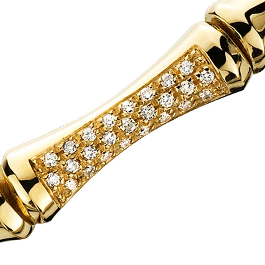 Signature bamboo styled bracelet, reminiscent of the classic mid-century design, nicely accented with .10 Cttw of diamonds. This 18k yellow gold bracelet was custom made by Molina for Campanelli & Pear. In Chinese culture, bamboo symbolizes