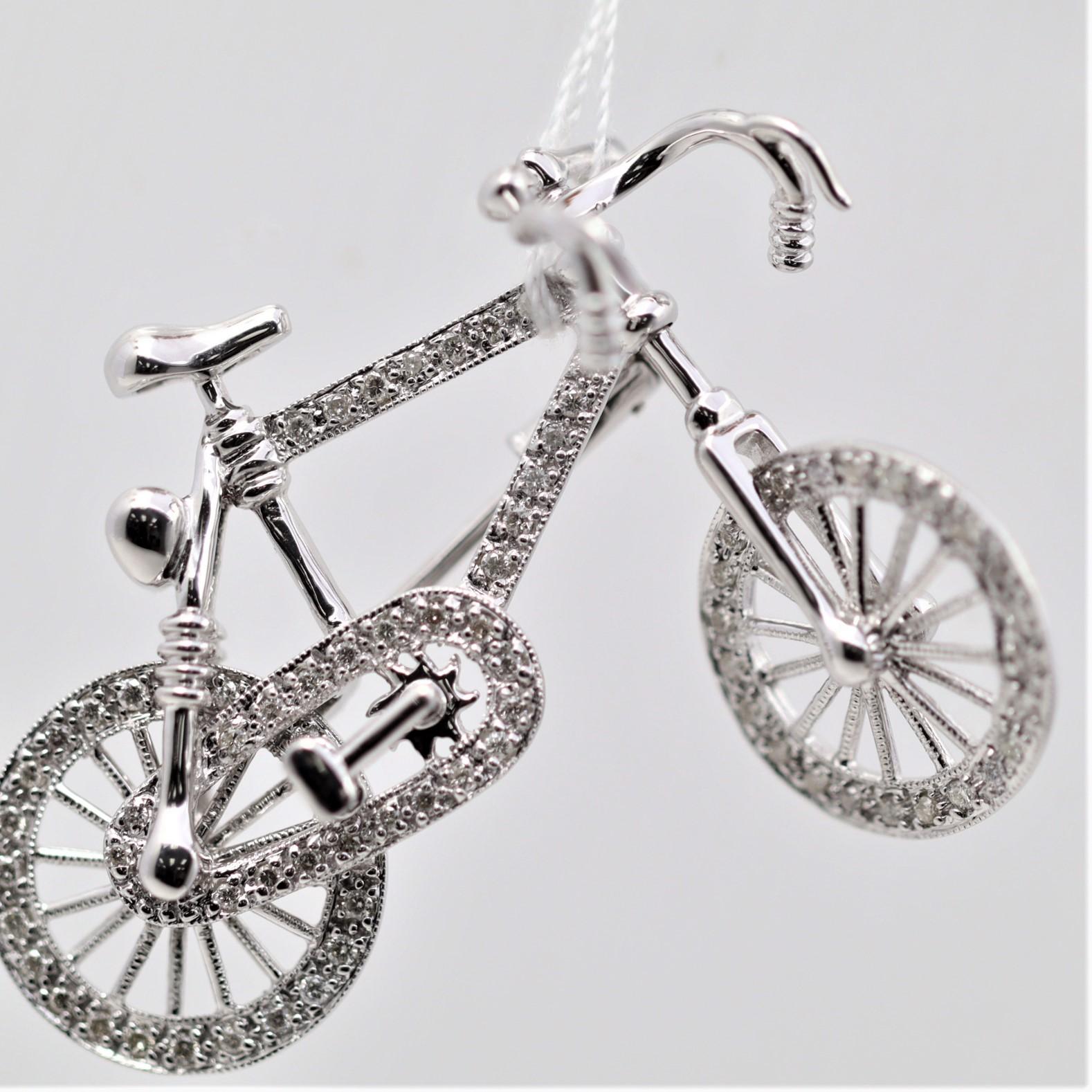 A cute pin made in 18k white gold in the form of a bicycle! Both of the bicycle wheels spin freely and the handlebars turn side to side as well. The bike is studded with 0.45 carats of diamonds taking it to the next level. Made in 18k white gold and