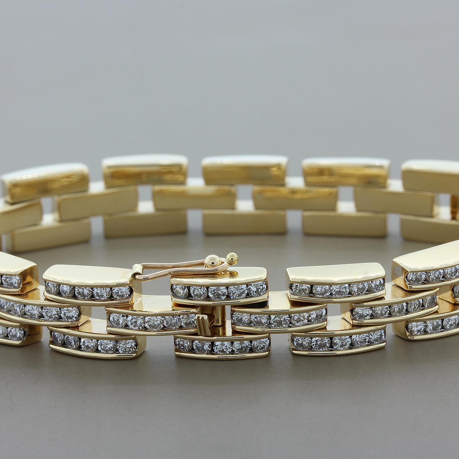 This sophisticated bracelet features 9.60 carats of round cut diamonds set in 14K yellow gold. The three rows of linked horizontal bars provide a box clasp closure and safety latch for safe keeping.  A classic bracelet to add to any