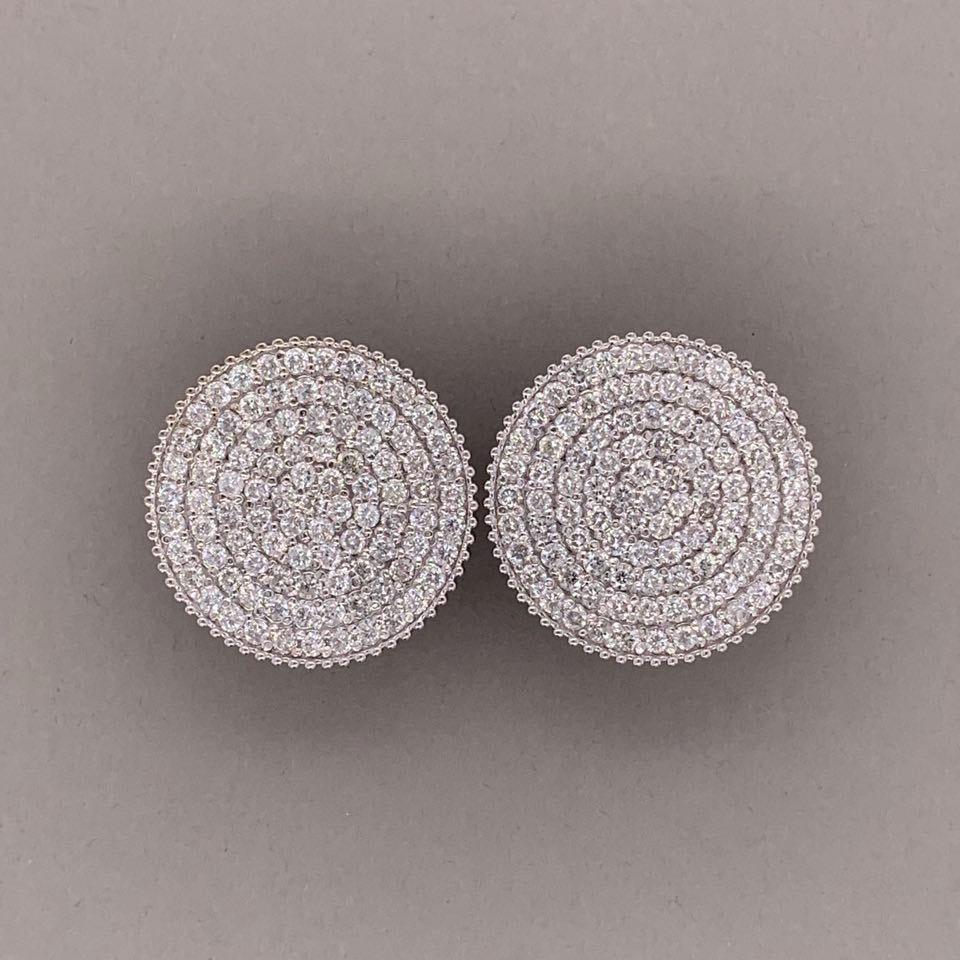 A lovely pair of round button earrings featuring 4.00 carats of round brilliant cut diamonds. The simple yet classic pair of earrings are finished with a clip and post for a secure closure. Made in 14k whtie gold these earrings will complement any