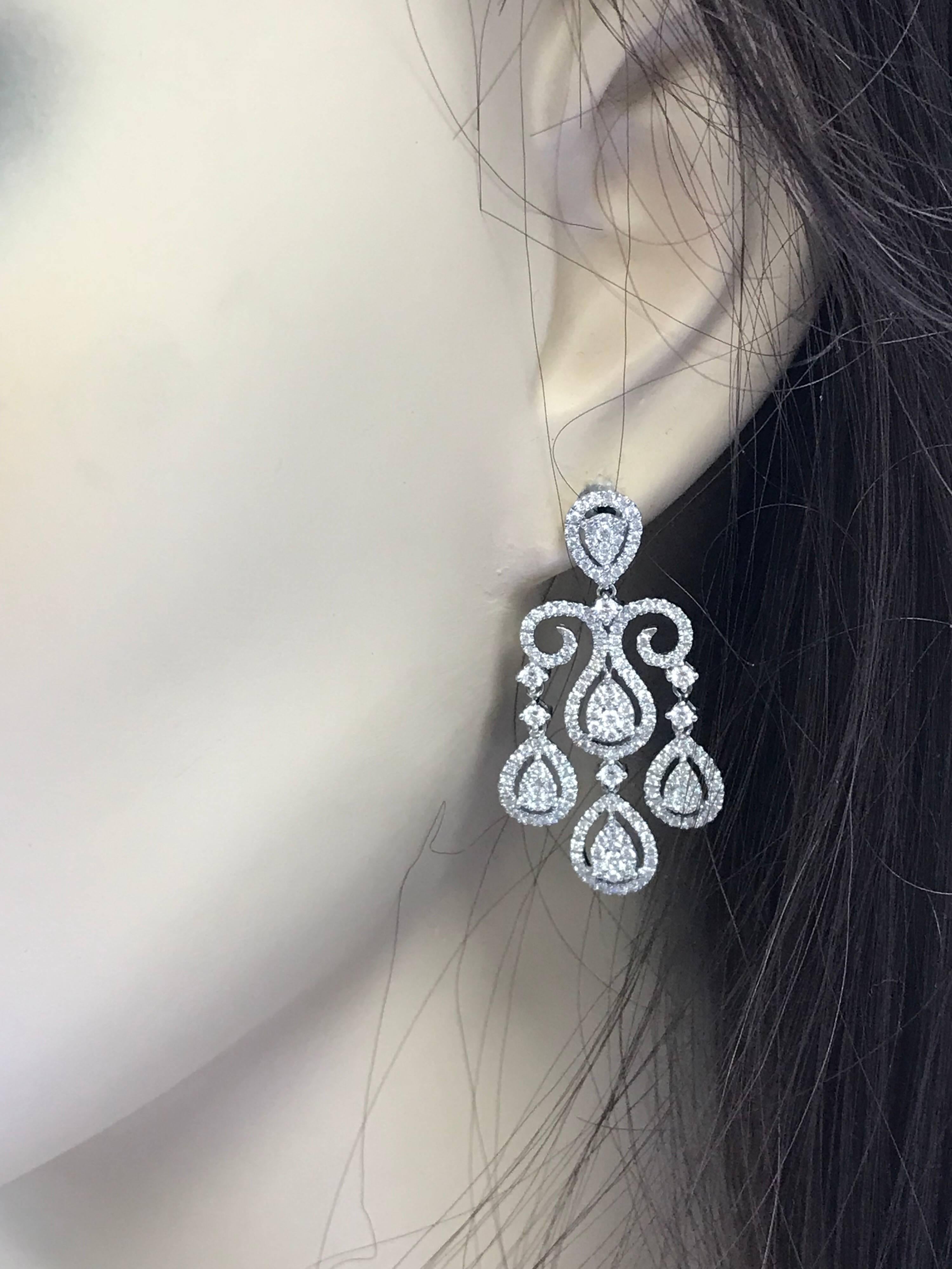 This Earring Features:
2.65 Cts. Total Cts. Weight
Gold: 18k white gold
Metal Weight: 8.5 g.
Diamond: Round
Diamond Count: 352
Diamond Color: G
Diamond Clarity: Si1+