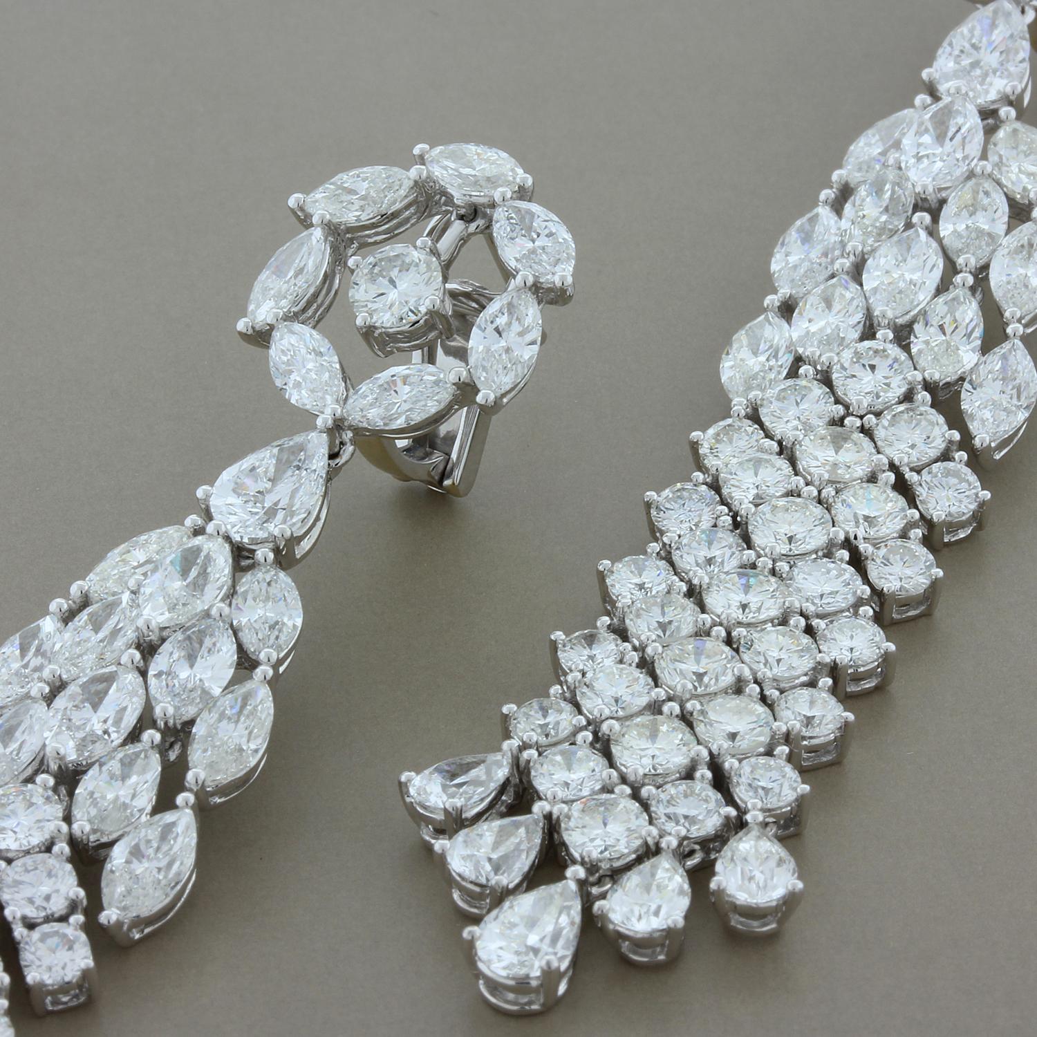 A dazzling pair of earrings draped in approximately 30 carats of multi-shaped diamonds, marquise, pear and round cuts all set in 18k white gold. An elegant piece of jewelry waiting to be worn. 

Earring Length: 3.5 inches
Earring Width: 0.65 inches