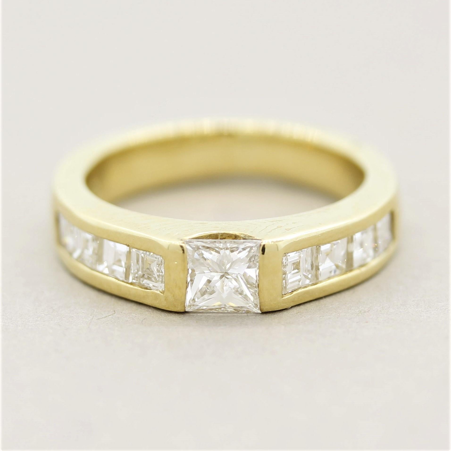 A simple yet stylish diamond band! It features a 0.62 carat princess-cut diamond in the center which is accented by 0.36 carats of square-shape diamonds. They are channel-set and run down the sides of the ring. Made in 18k yellow gold, a fine