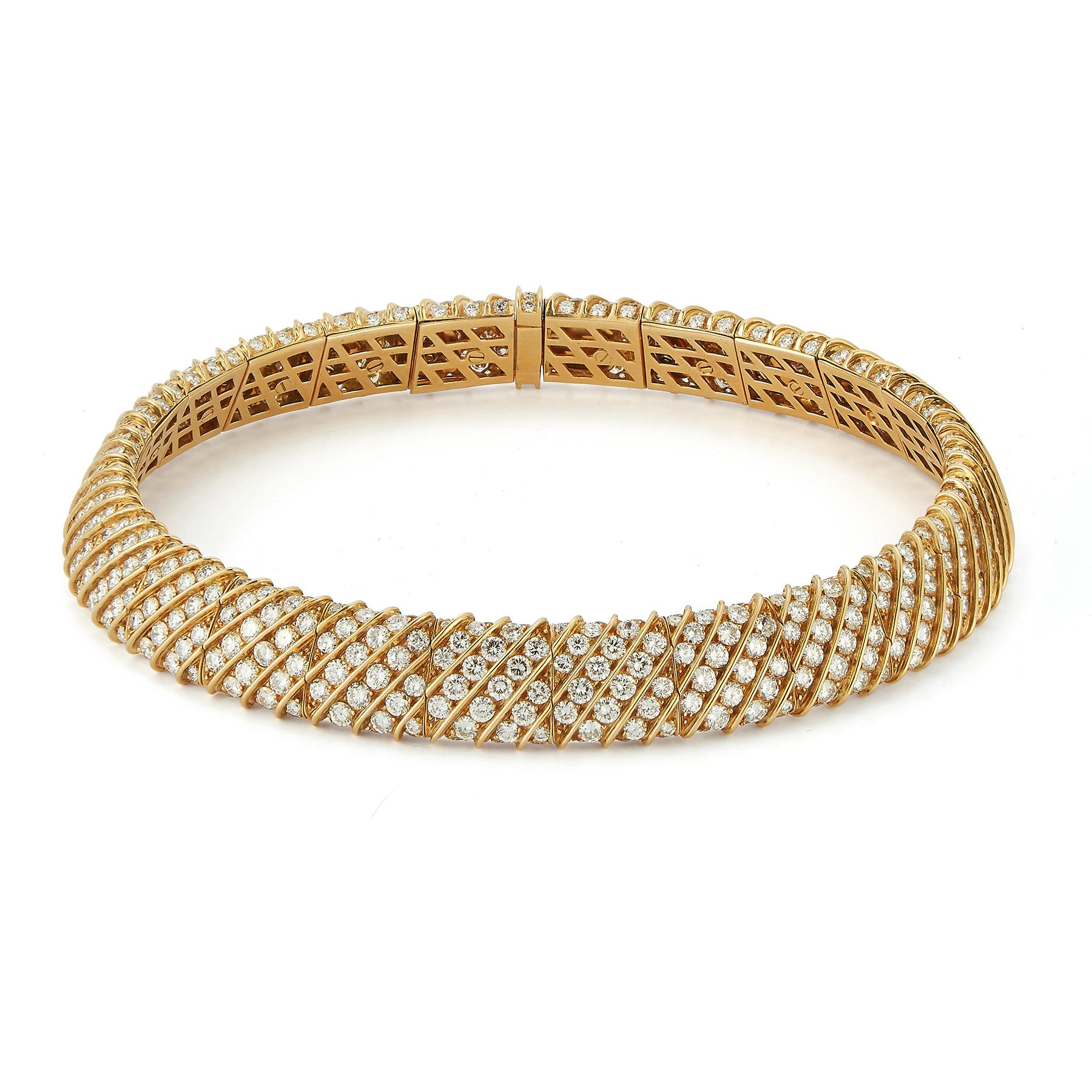 Diamond & Gold Choker Necklace

Round cut diamonds weighing: approximately 62.00 cts 

Measurements: 13