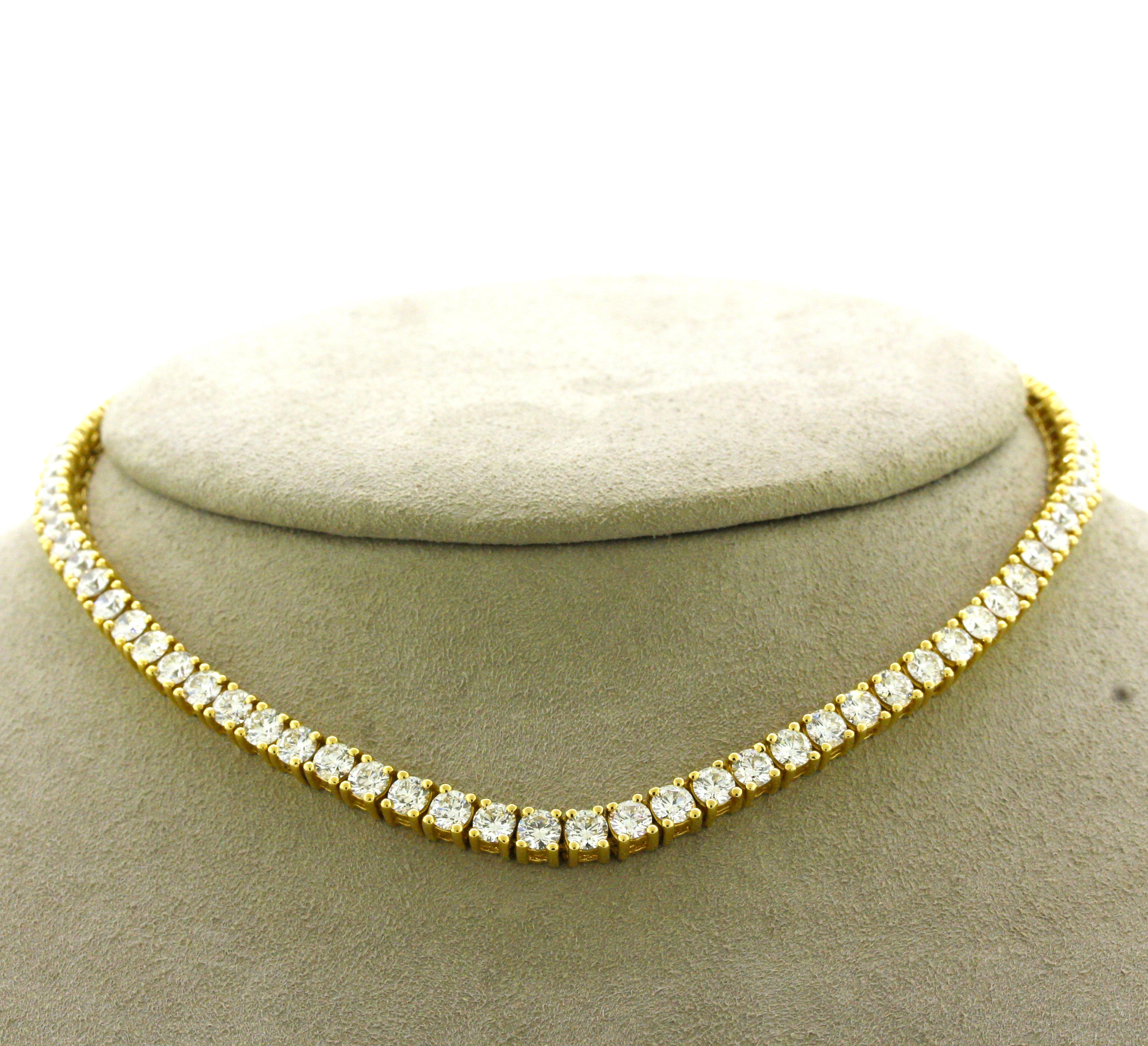 A classic tennis necklace made to wear as a choker. It features 16.22 carats of bright white round brilliant-cut diamonds set in a row of 18k yellow gold. Made in 18k yellow gold with a smooth finish on its back side to allow a comfortable feel