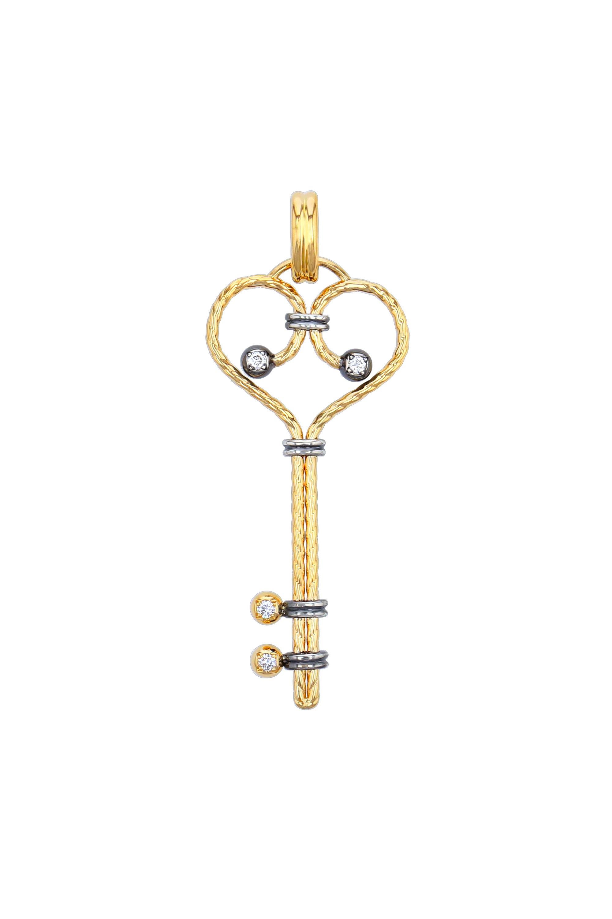 Clef charm, serpentine yellow gold twist punctuated with gold and silver balls, set with a diamond held by a set of distressed silver rings. Openable gold bail. 

Sold without chain.

Available with chain on request. 

Details:
GVS Diamonds: 0.16