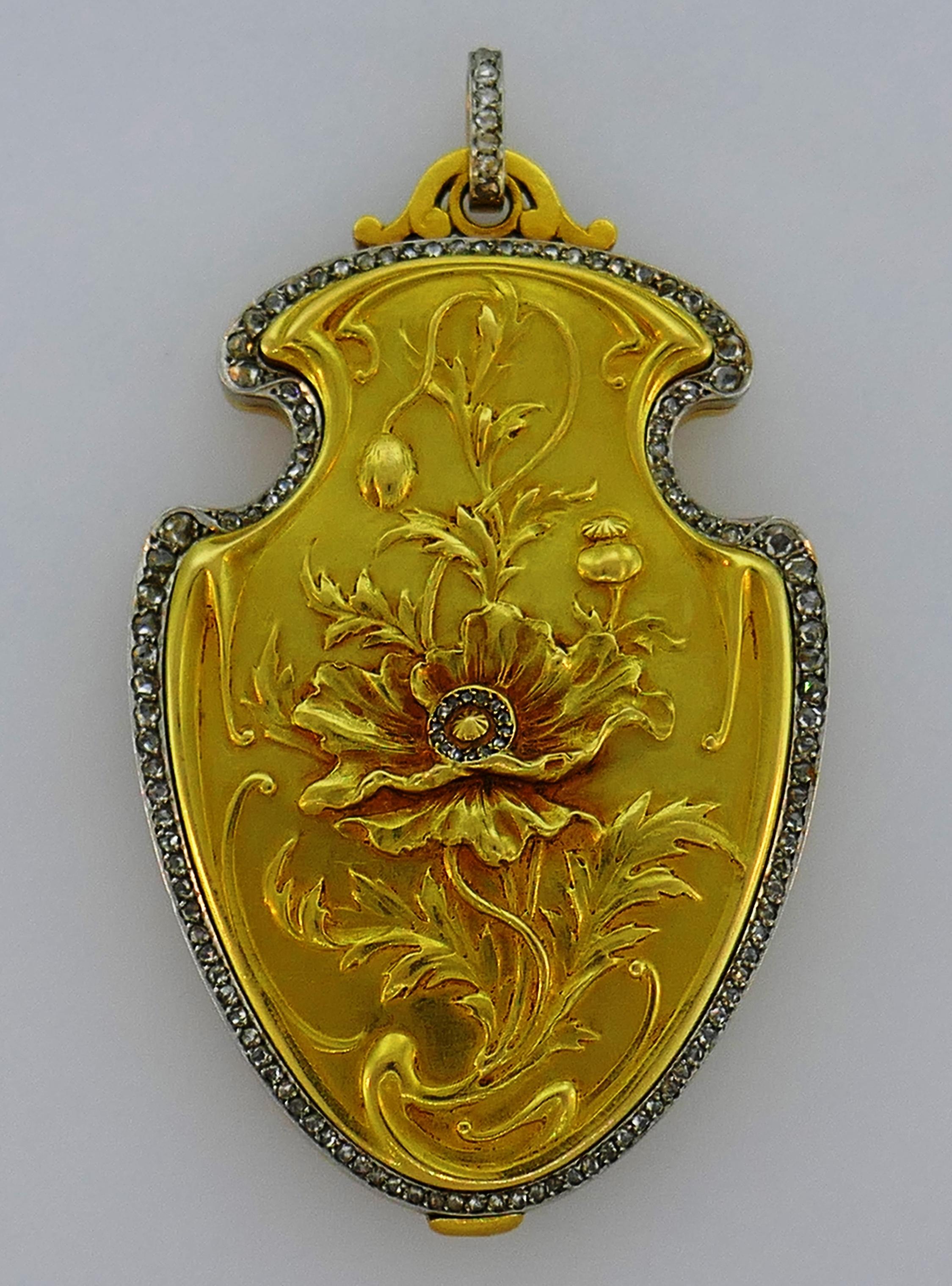 Amazing Art Nouveau pendant created in France in the 1930s. 
Made of 18 karat yellow and white gold and accented with rose cut diamonds. Beautiful work on gold! Unusual, artsy and wearable, the pendant is a great addition to your jewelry