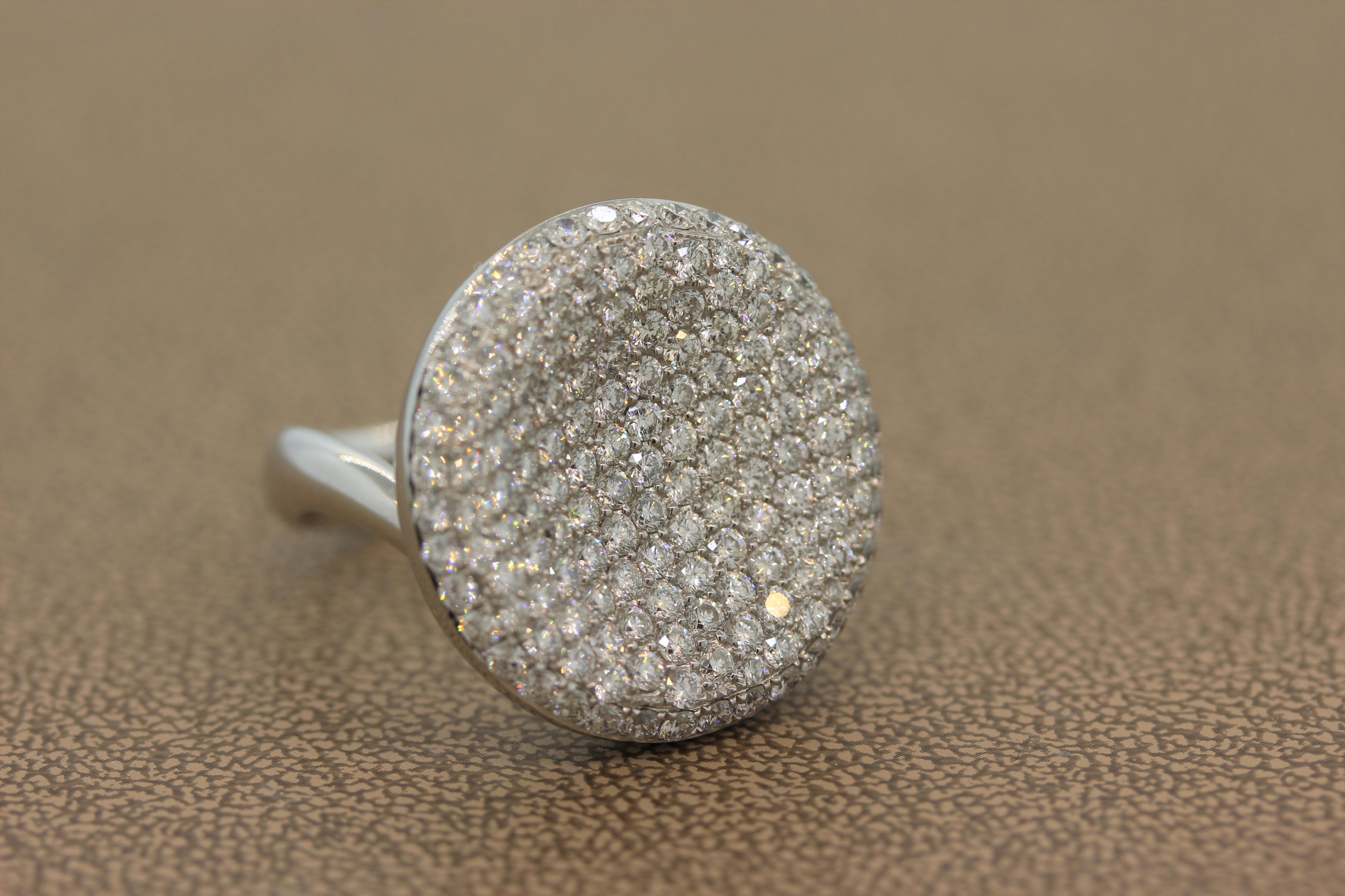 This cocktail ring is an absolute stunner! A glamorous ring featuring 3.95 carats of VS quality round brilliant cut diamonds pave set in a spherical concave ring. The shimmering round cut diamonds are set in 18K white gold.
Ring Size 6.75 (Sizable)
