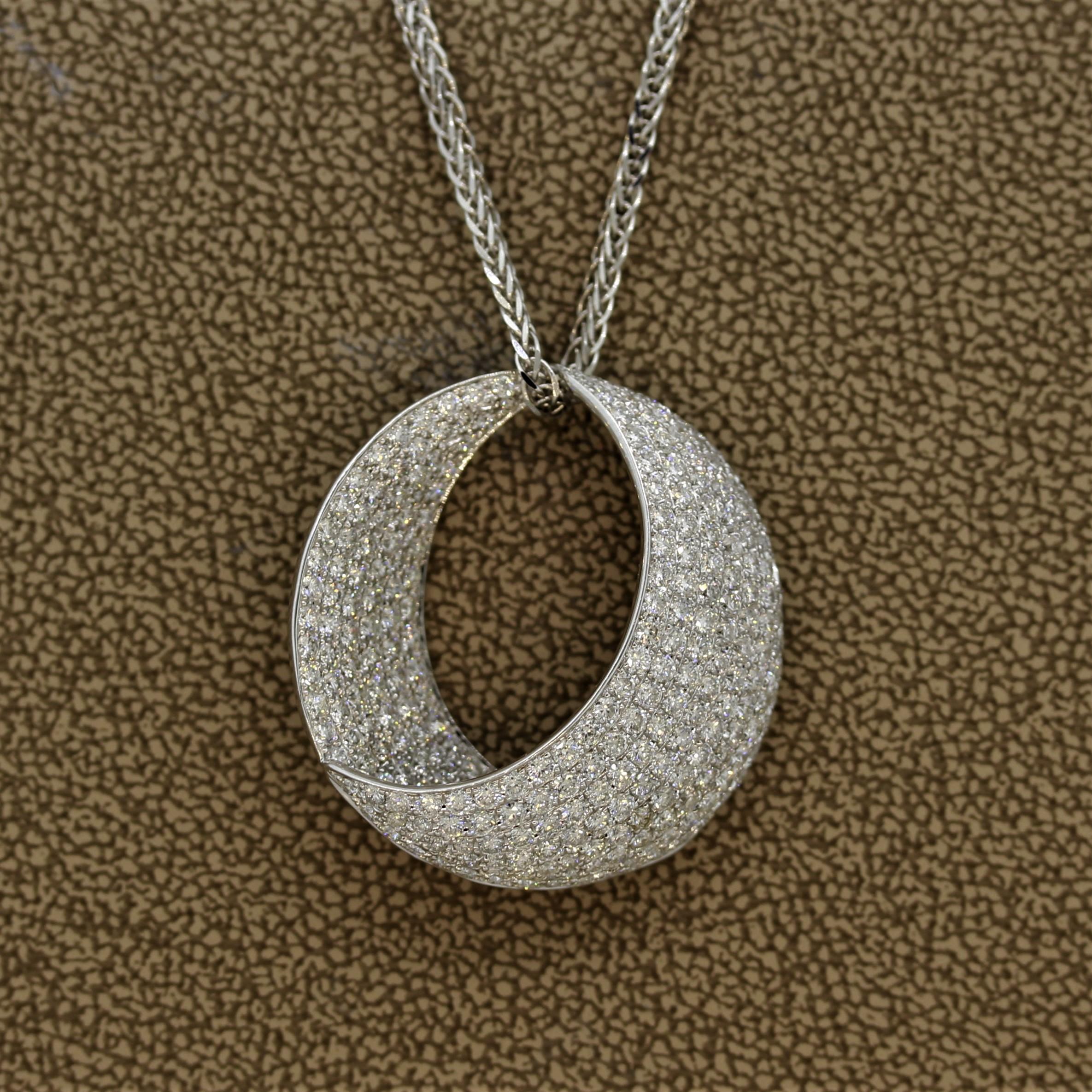 A lovely and finely made pendant featuring 4.70 carats of round brilliant cut diamonds with VS1-2 clarity. It is set in 18k white in a crescent shape.

Pendant Length: 1.1 inches

Chain Length: 16 inches