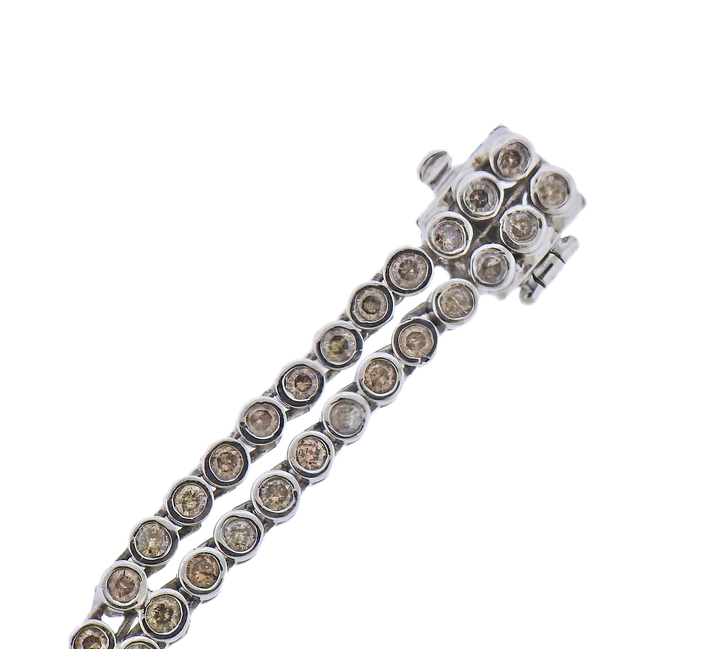 14k white gold double line bracelet with bezel set diamonds - approx. 3.00ctw in diamonds total. Bracelet is 7.25
