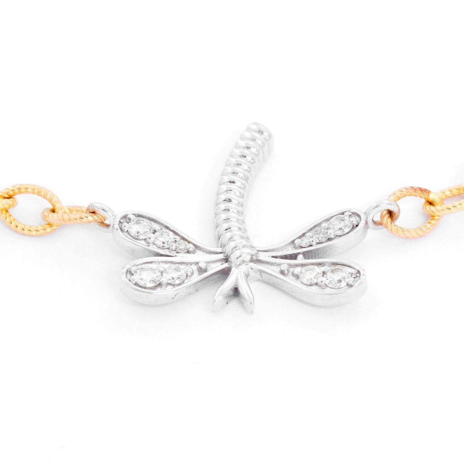 Diamond & Gold Dragonfly Bracelet - Beautiful White gold diamond dragon fly charm on a link yellow gold bracelet. Eight diamonds weighing .25 cts. Total length 9 inches. Can be made to wear smaller .