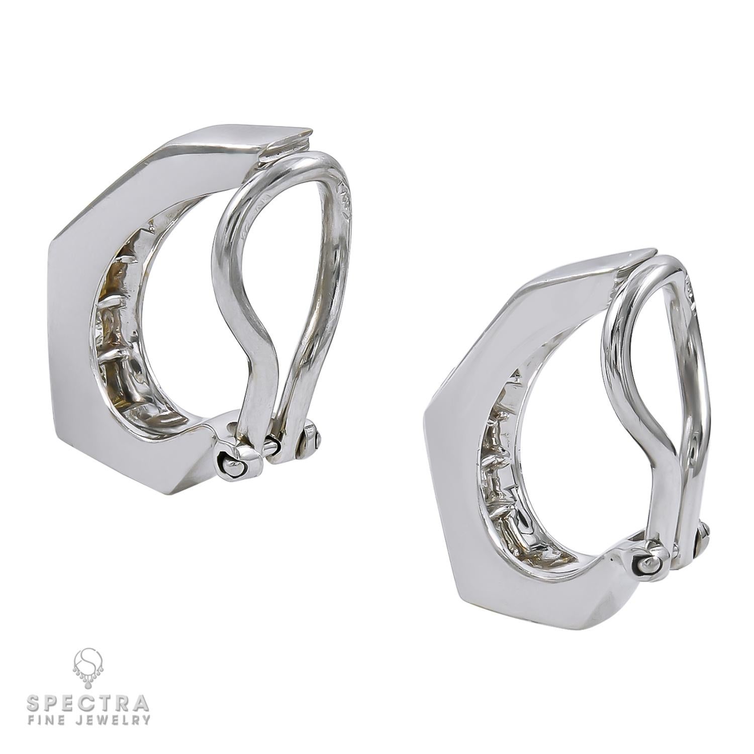 There is something so pleasingly succinct about the geometric design of these ear clips. The repeating concentric squares reflected in a row of diamonds, perfectly lined up and channel set in gleaming 18K white gold, is mesmerizing. In a minimalist