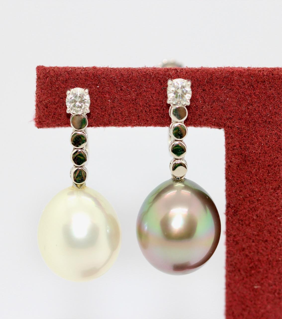 Charming diamond earrings set with natural white and gray South Sea pearl, Tahitian pearl. 18 Karat White Gold.

The Pearls each have a diameter of approx. 11.8 mm

Includes certificate of authenticity.