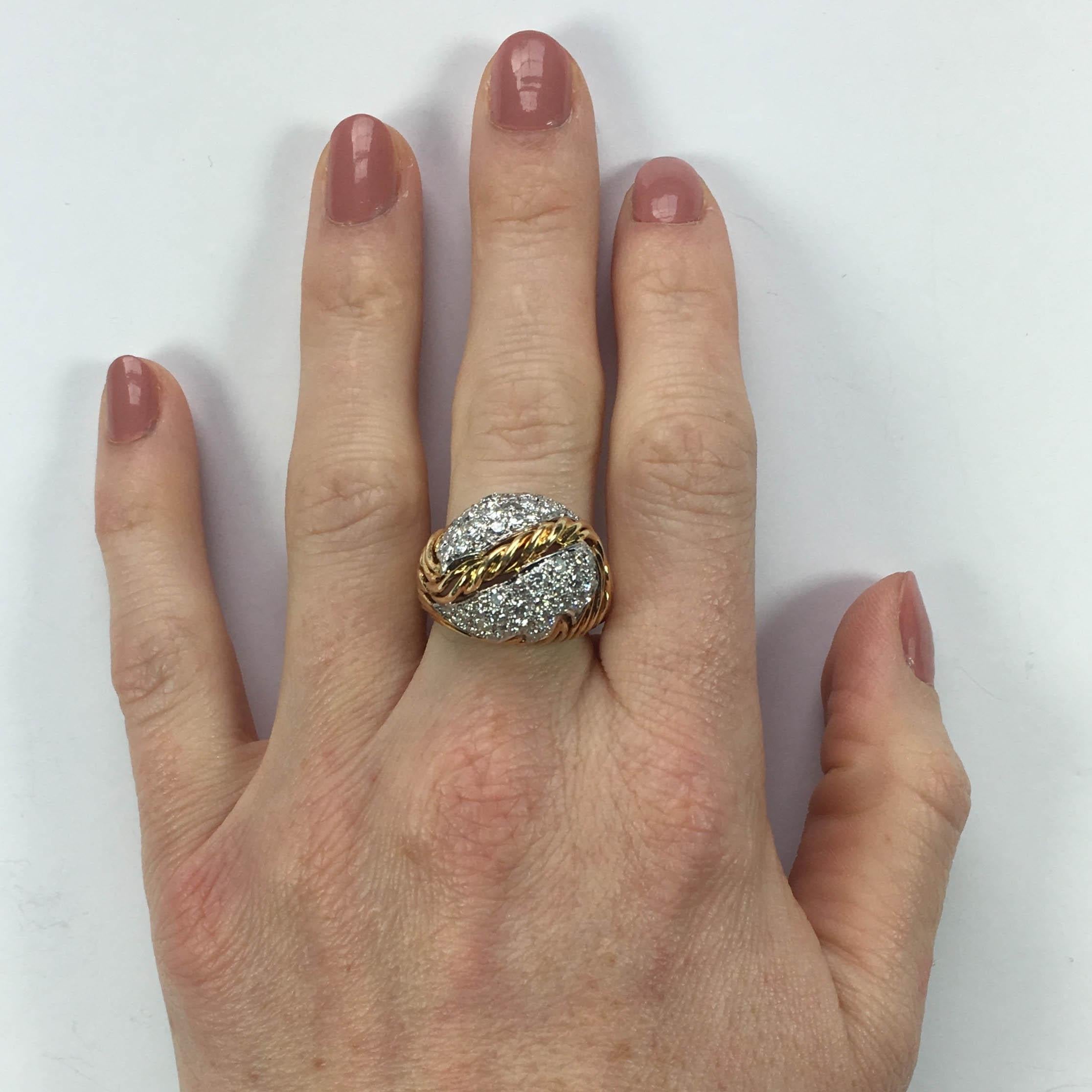 A fabulous dome ring designed as wirework strands of golden grass supporting a pavé set diamond leaf with a twisted gold central vein.   The perfect ring for autumn/fall!

The ring is set with 48 round brilliant-cut diamonds with a total approximate