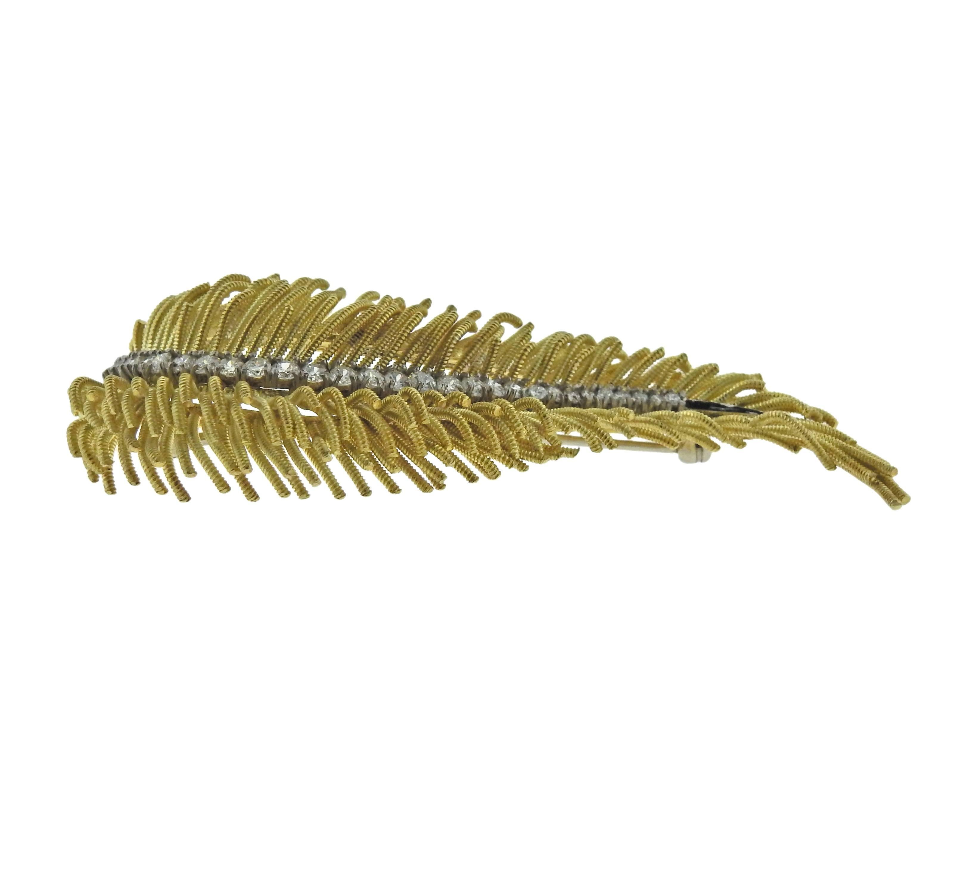  18k yellow gold feather brooch, decorated with approx. 0.90ctw in G/VS diamonds. Brooch is 68mm x 28mm, weighs 23.1 grams. Marked: 18k Italy.