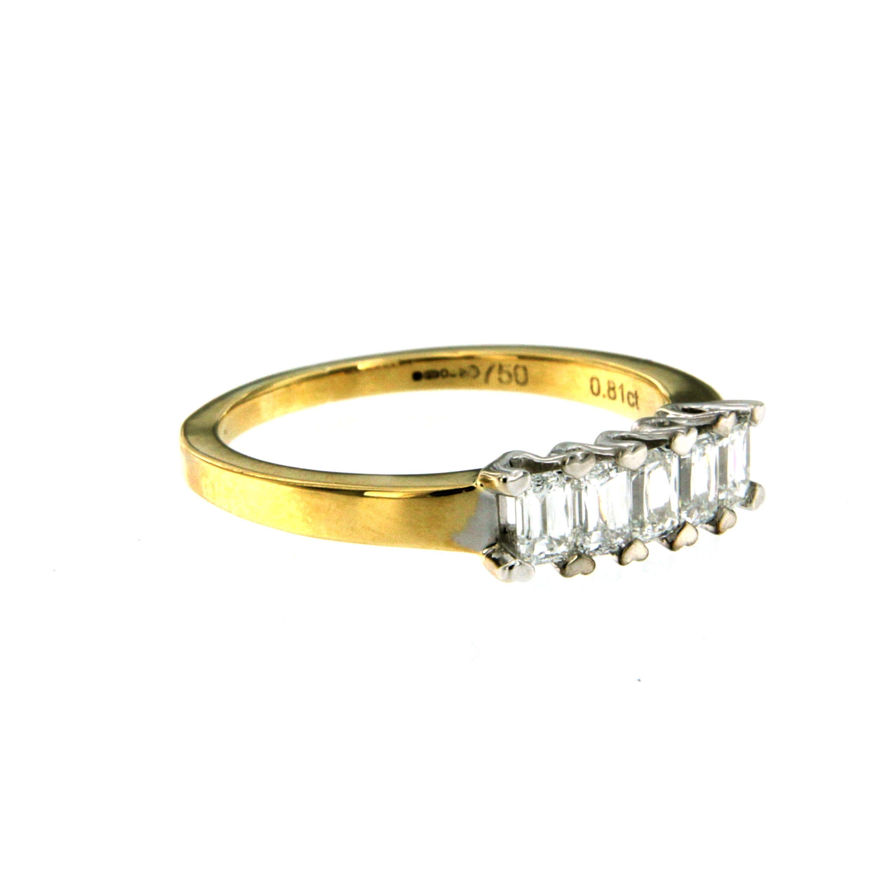This diamond band ring is set with five shiny and sparkly baguette cut diamonds totalling 0.81 ct. estimated to be G in color and VS1 in clarity.
The band is 18k yellow gold, and the diamonds are set in 18k white gold. Circa 1980

CONDITION: