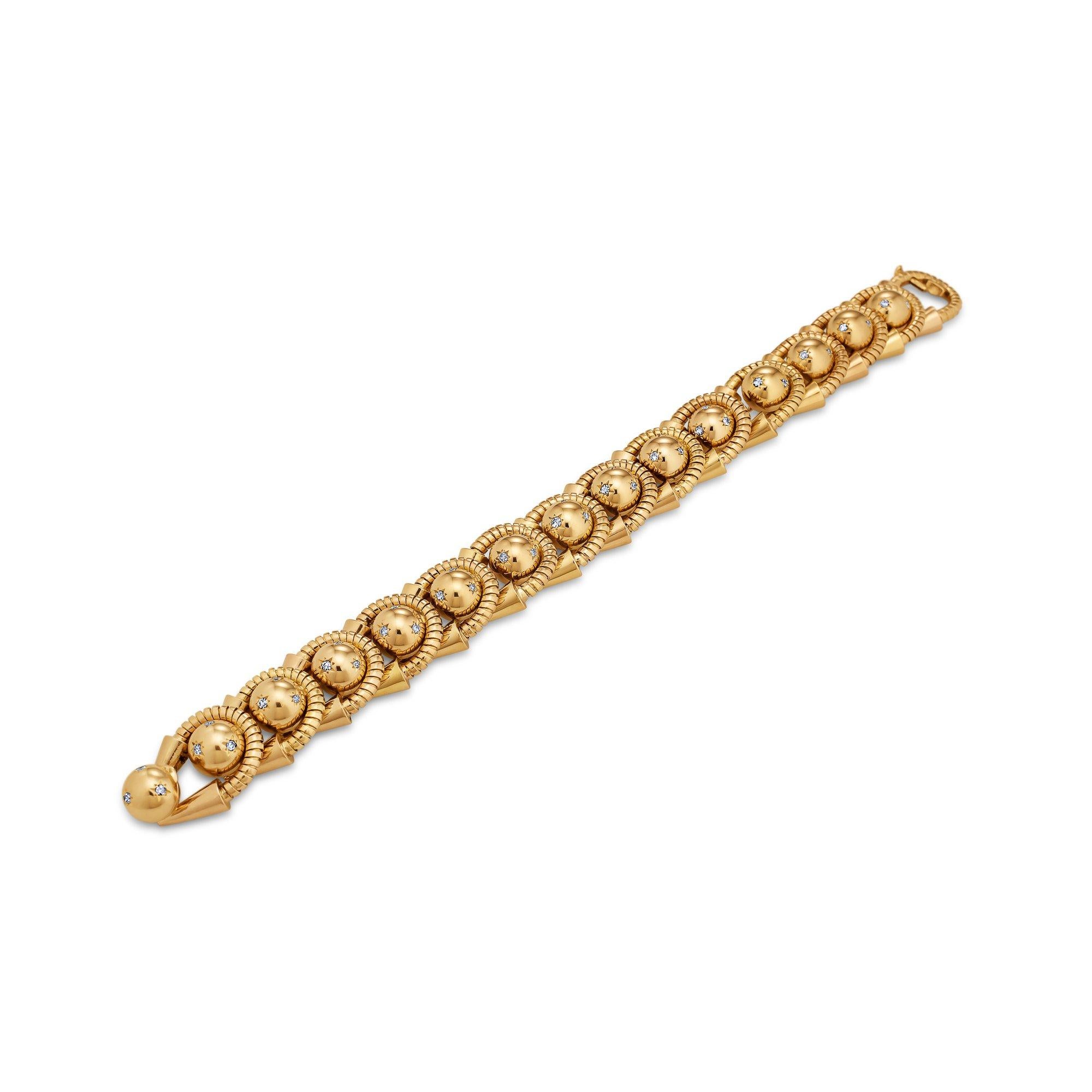 A glamorous combination of alternating golden coils and diamond set spheres line up to create this unique 1930's French handmade bracelet.  With a total of approximately .85 carats of round cut diamonds mounted into rose gold spheres, this bracelet