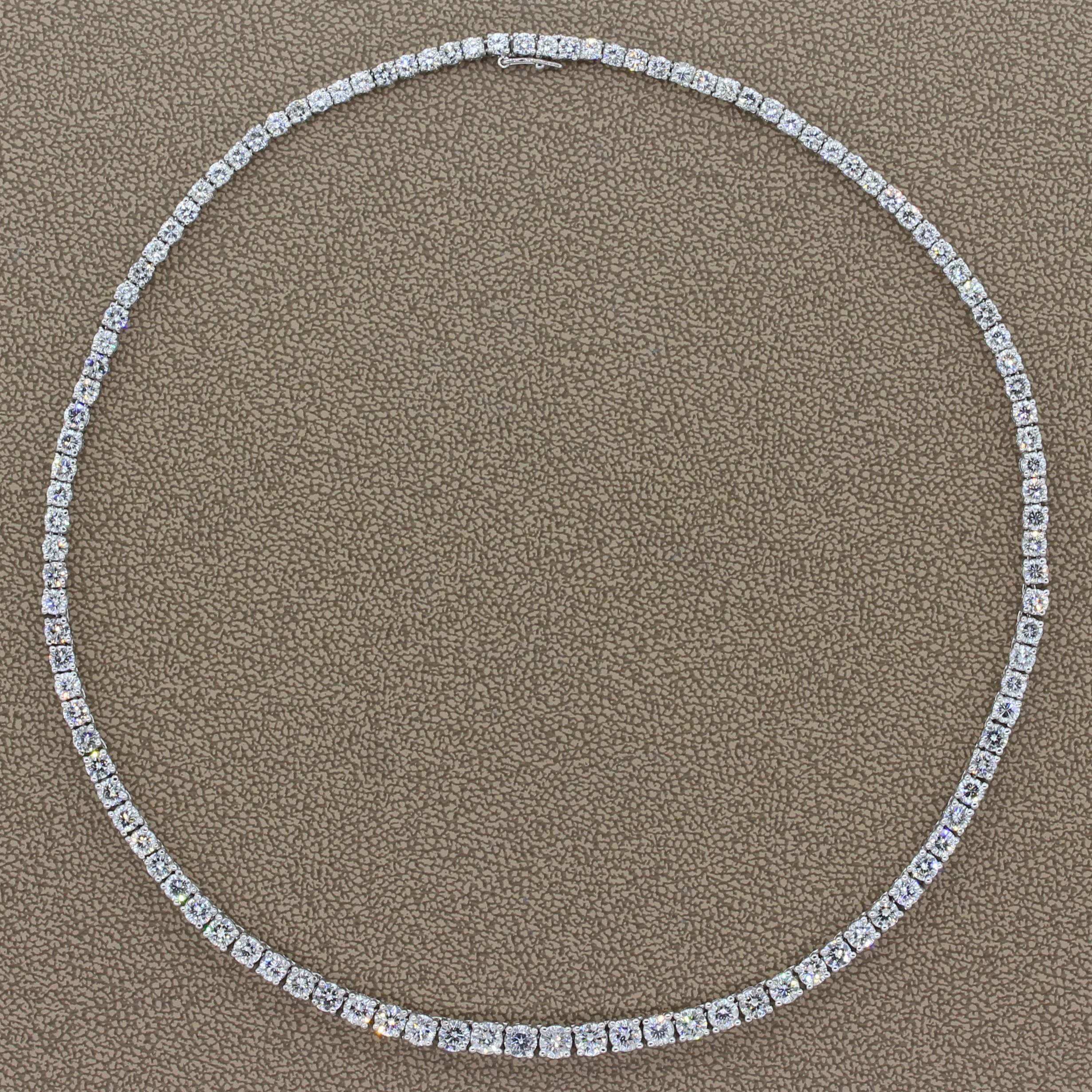 A traditional sleek tennis necklace featuring 10.00 carats of round cut diamonds. The colorless graduating diamonds are prong set in 18K white gold. This necklace is secured with a box clasp closure and a safety latch for added security.

Necklace