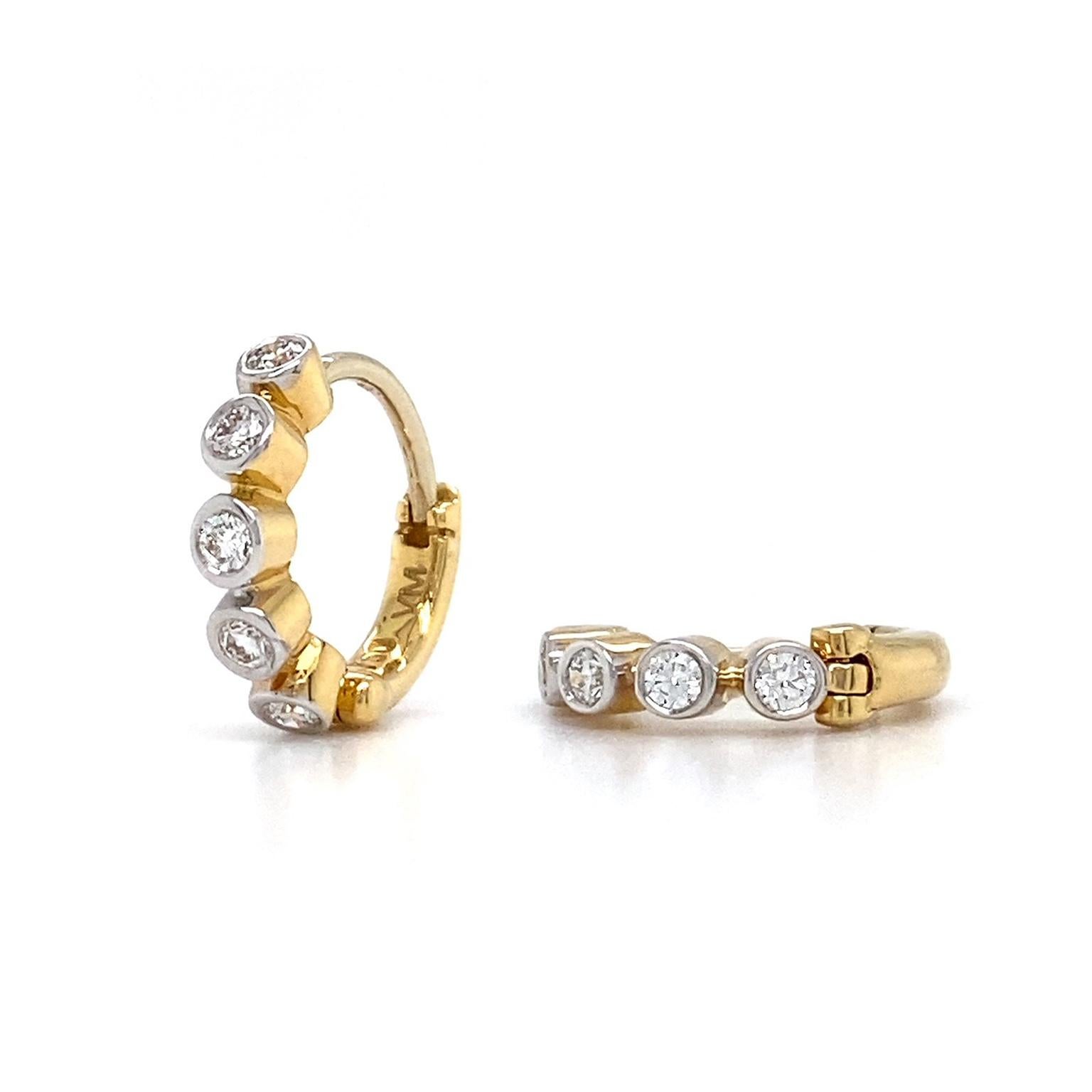 Valentin Magro 18 Karat Yellow Gold Diamond Hoop Earrings transform precious metal and texture into one. The foundation is 18k yellow gold, creating five linked bezel settings for each of the featured diamonds. These jewels are round brilliant cut