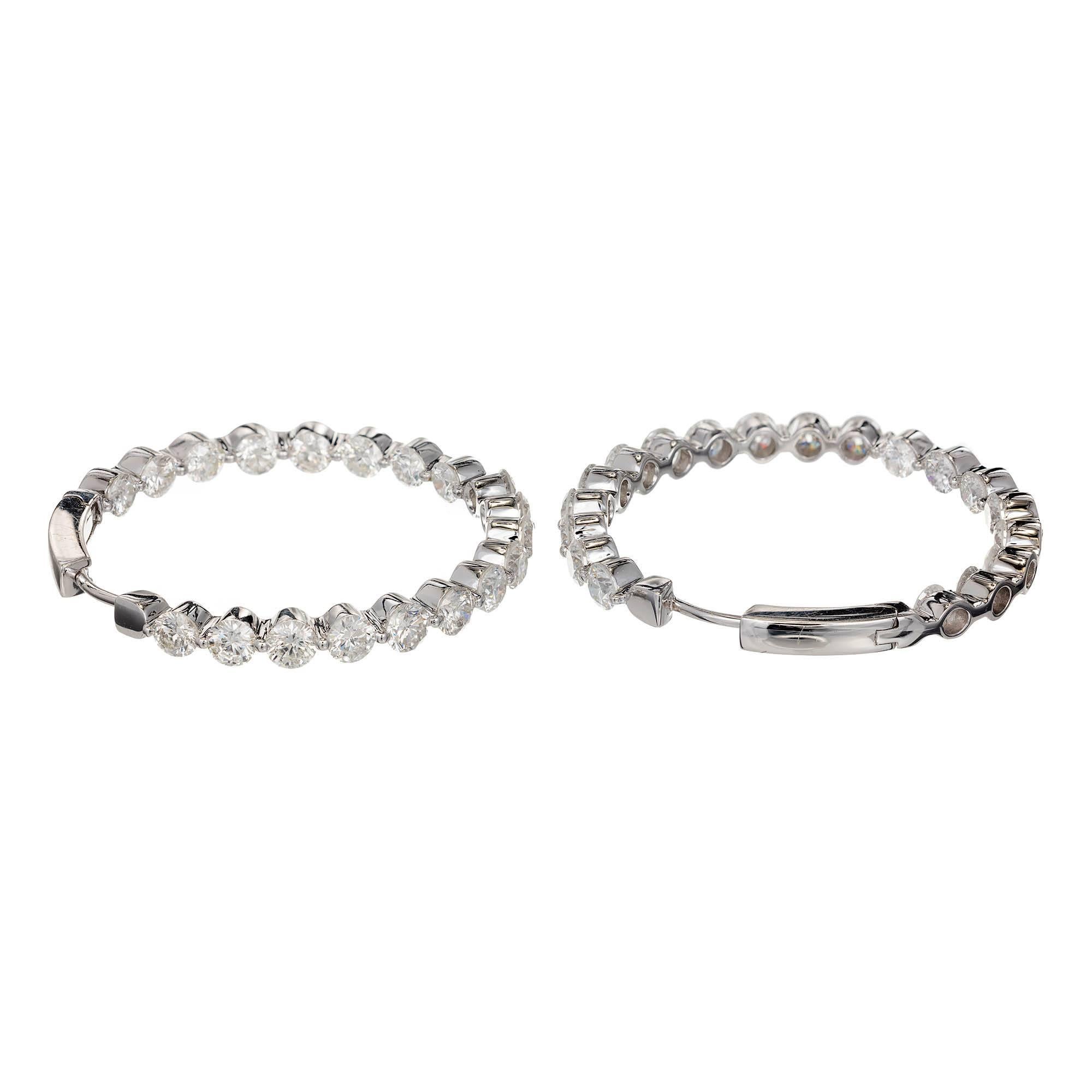Ideal cut 1 3/8 inch diamond, diamond hoop earrings from the maker TP in 18k white gold. Extra well cut diamonds. Extra well-made hoops. Secure locking mechanism. 
38 Ideal cut diamonds E color, VS2 to SI1 clarity. 6.07ct total weight
18k White
