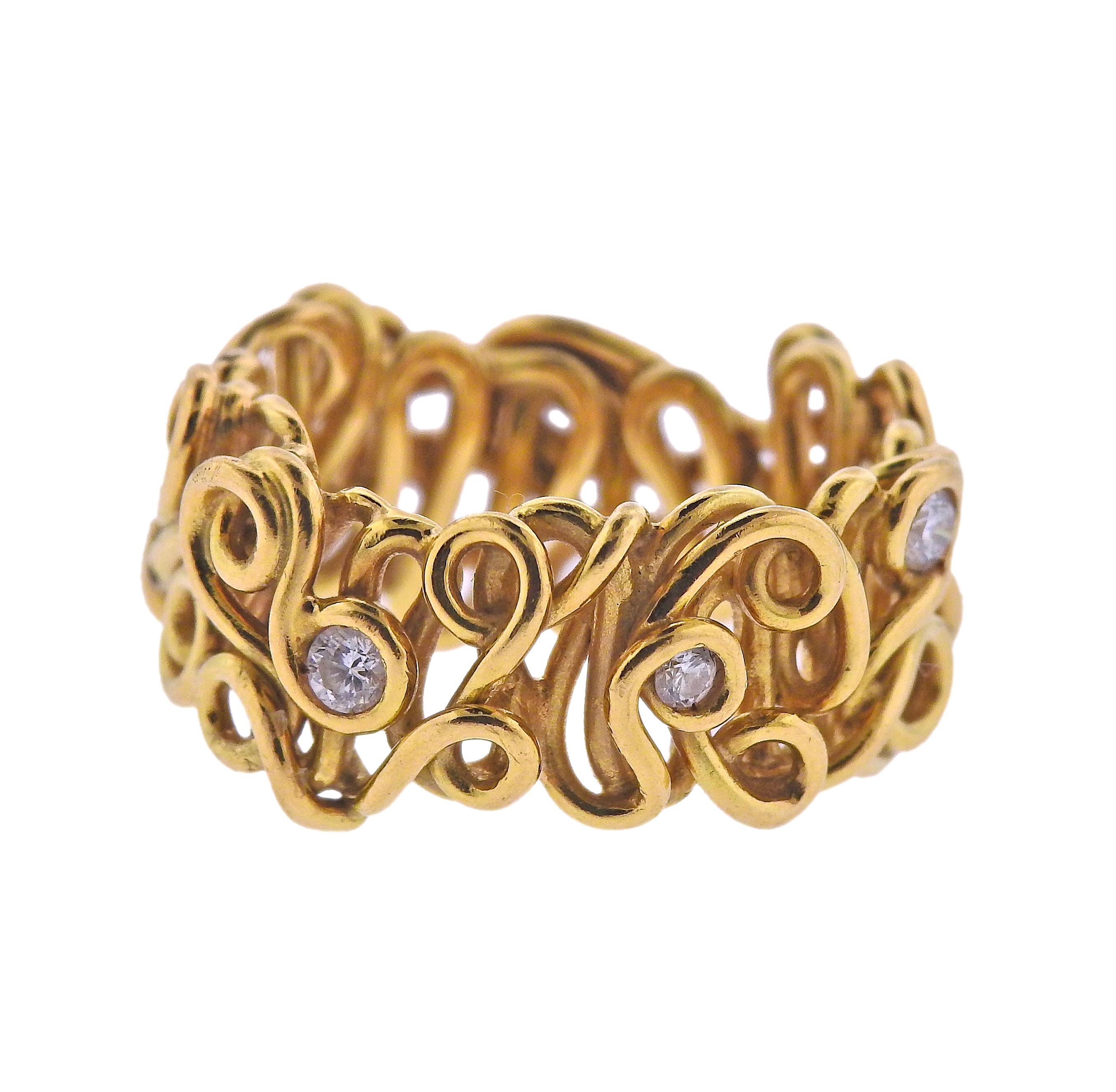 18k yellow gold band ring with intertwined design, adorned with approx. 0.40ctw in diamonds. Ring size - 7, ring is 12mm wide. Weight - 10.1 grams. 