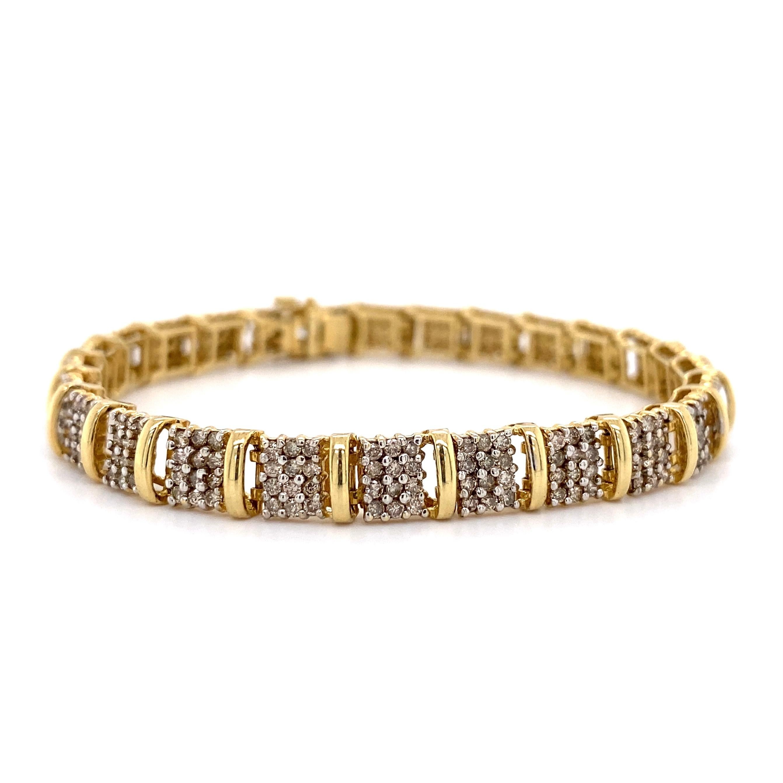 Simply Beautiful and Finely Detailed Gold Link Bracelet with alternating Diamond spacer links. Hand crafted in 14K Yellow Gold and Hand set with 312 round Diamonds approx. 2.34 total Carat weight. Approx. 7” long. Dimensions 7” l x 0.25” w x 0.16”