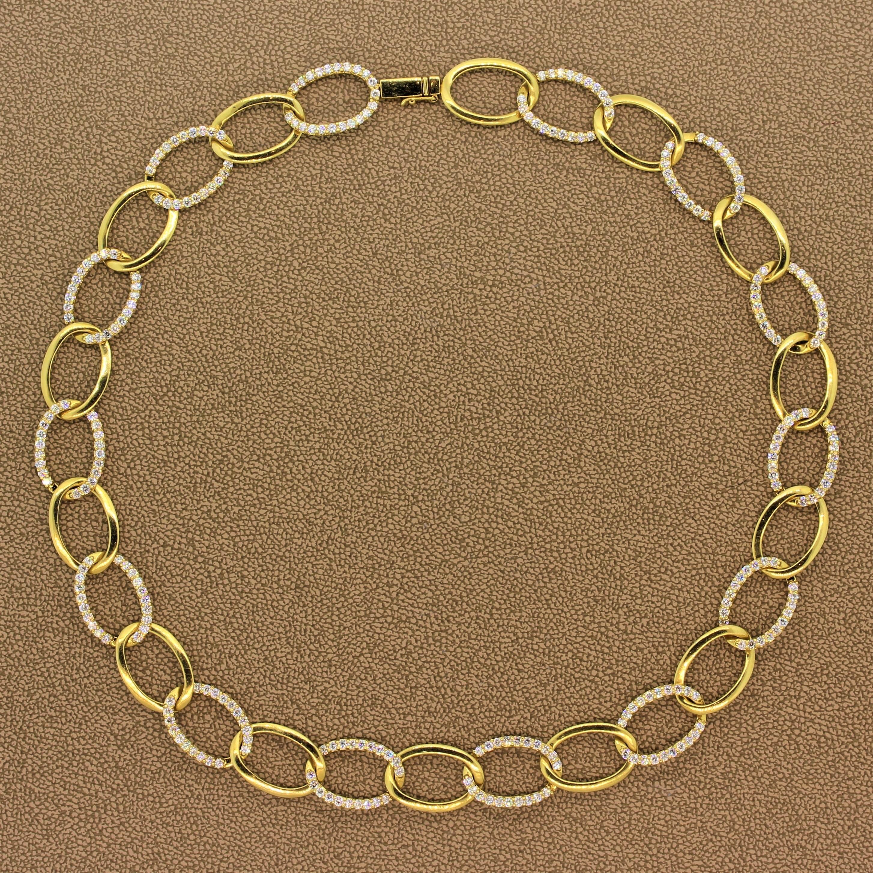 A beautiful and fun necklace featuring 7.26 carats of VS quality diamonds. The round cut diamonds are set in 18K yellow gold oval shape hoops linked to one another. A box clasp and safety latch ensure for a secure closure. A true piece of fine