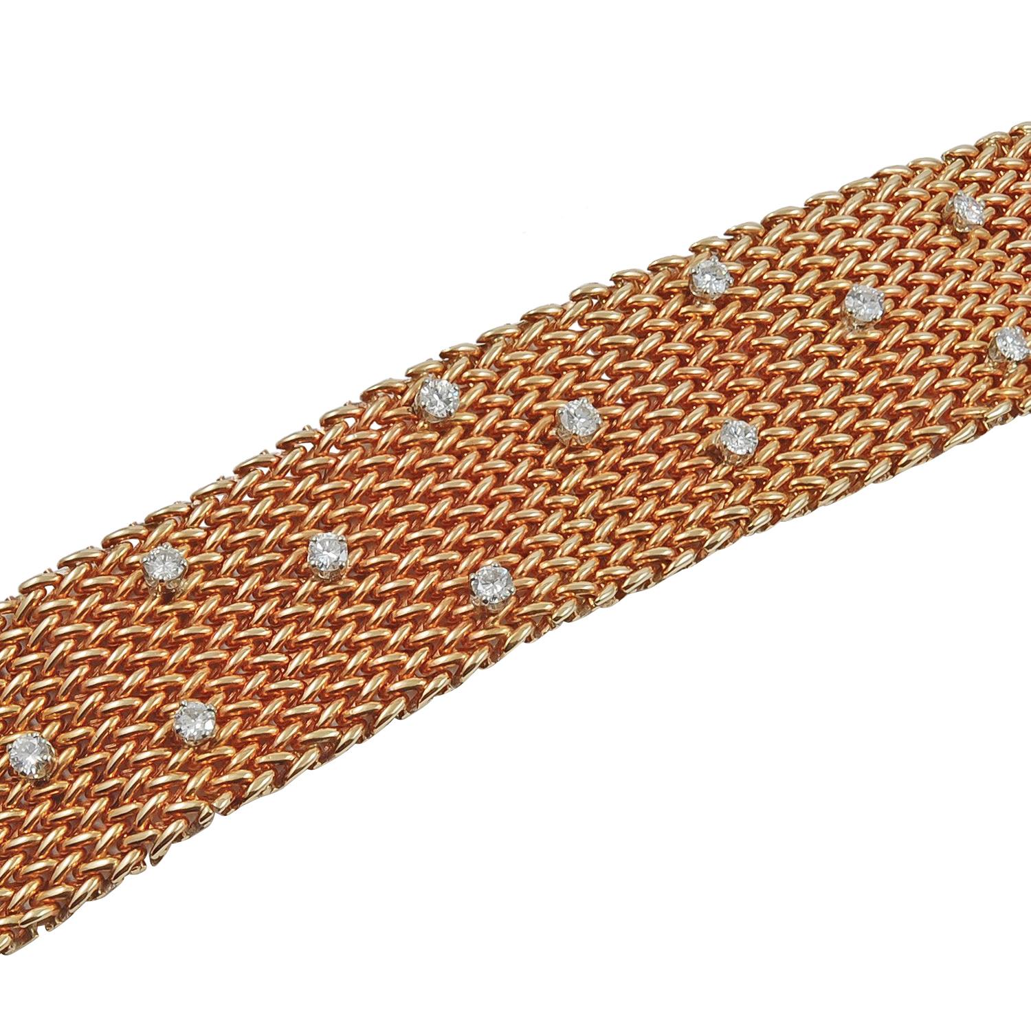 An 18k yellow gold mesh design bracelet, set with round diamonds, circa 1970s
Measures approximately 6.75″ in length by 1″ in width
Condition: Good – Previously owned and gently worn, with little signs of use. May show light scratches but has no