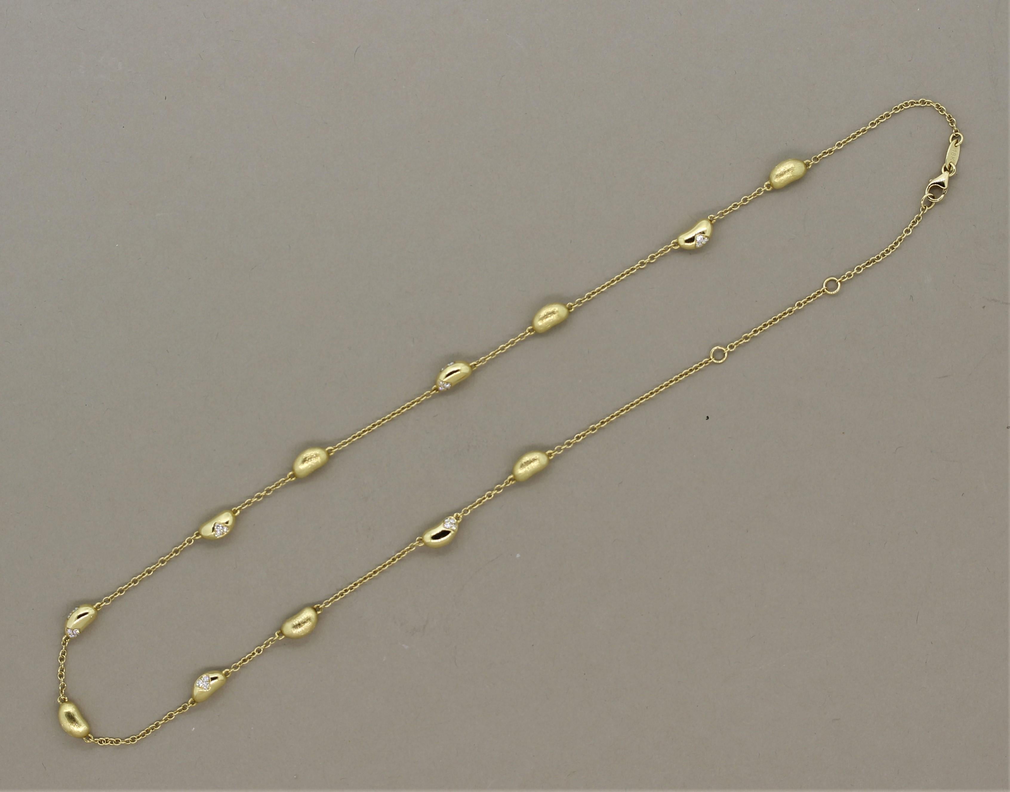A simple yet stylish necklace made in the diamond by the yard style! It features golden nuggets of 18k yellow gold set across the chain. Every other nugget is set with round brilliant cut diamonds totaling 0.33 carats. The nuggets without diamonds