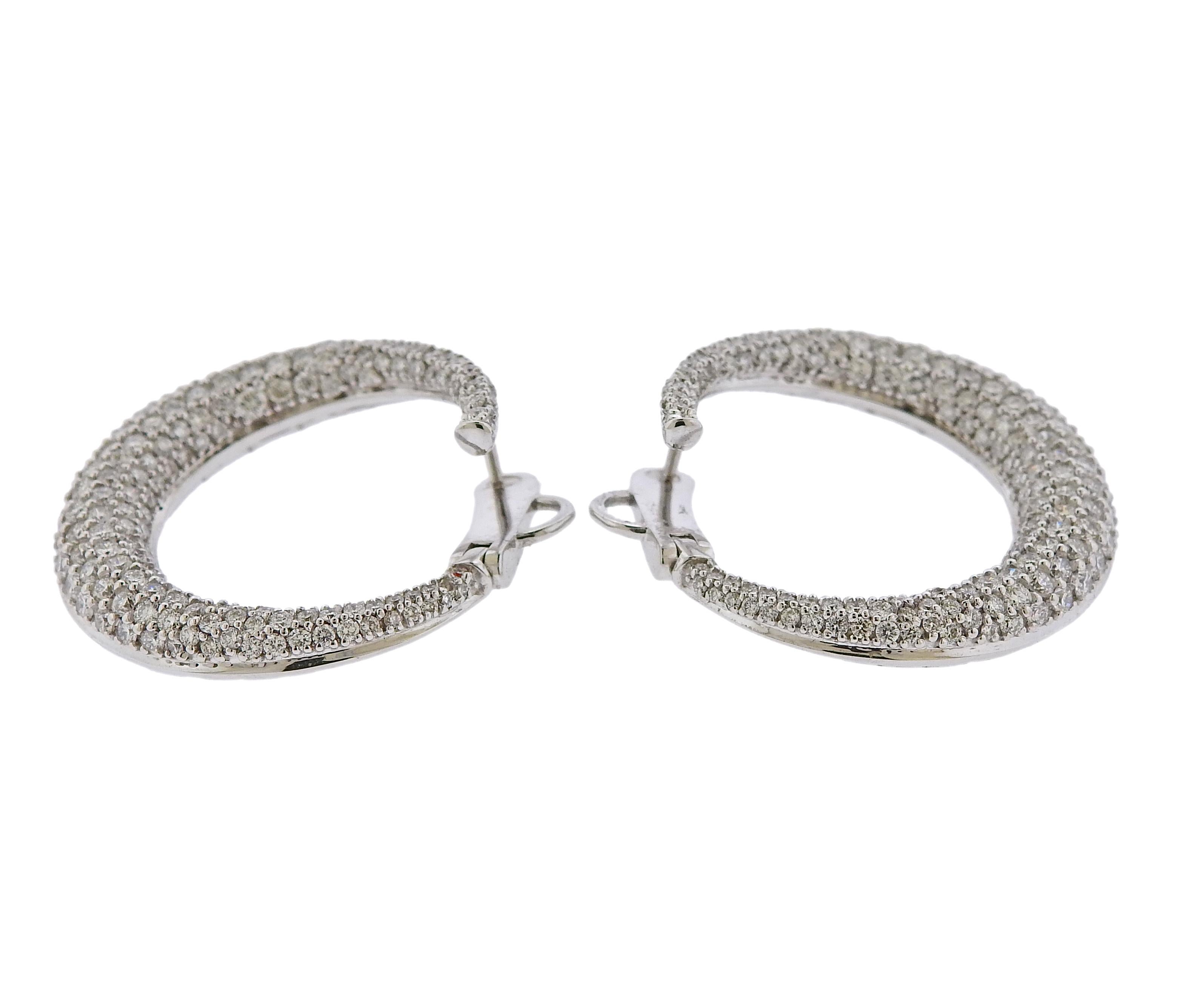 Pair of open circle earrings, set with approx. 3.10ctw in G/VS diamonds. Earrings are 26mm in diameter. Weight is 13 grams. Marked 750, Italian mark.