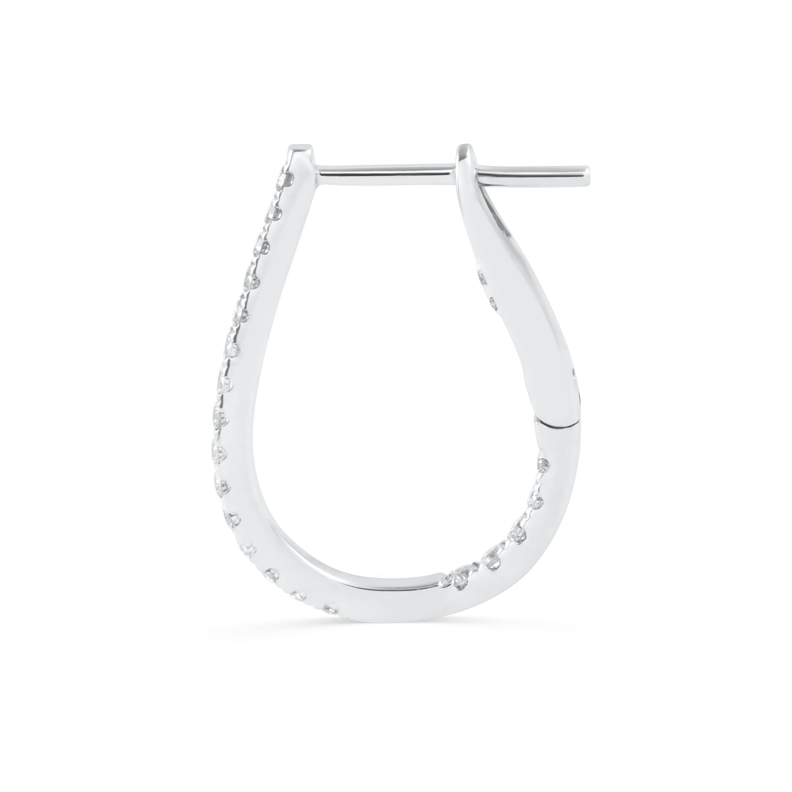  A non-traditional yet gorgeous pair of hoop earrings designed like a pear shape embellished with sparkling round diamonds. Diamonds weigh 0.46 carats total. Length approximately 0.75 inches. Made in 18k white gold.

Style available in different