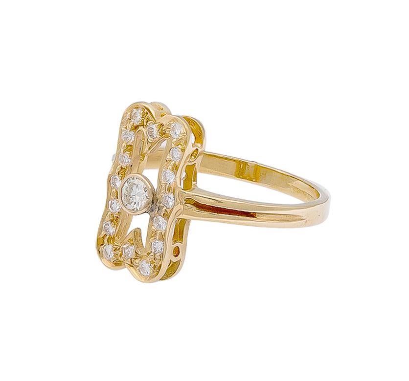 A petite yet beautiful diamond ring -somewhat modernized filigree design. This ring features a round brilliant diamond in the center in which is guarded by smaller diamonds around. The total diamond weighs approximately .30 carats and is set in a