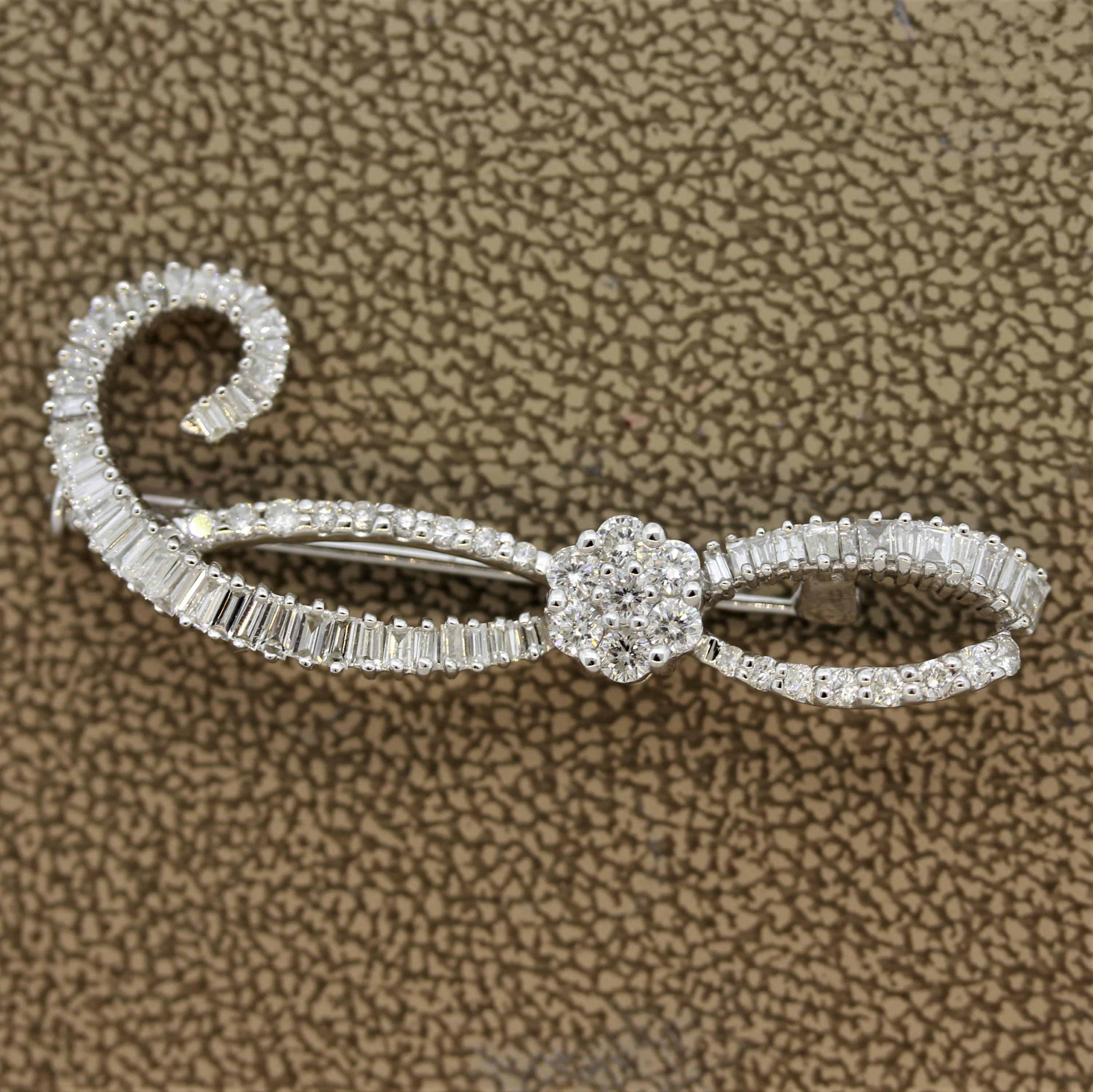 A chic spray brooch in a smaller size making it more easily wearable day to day. It features 1.75 carats of round brilliant and baguette cut diamonds. Easy to wear with most outfits and occasions, made in 18k white gold.

Length: 1.6 inches