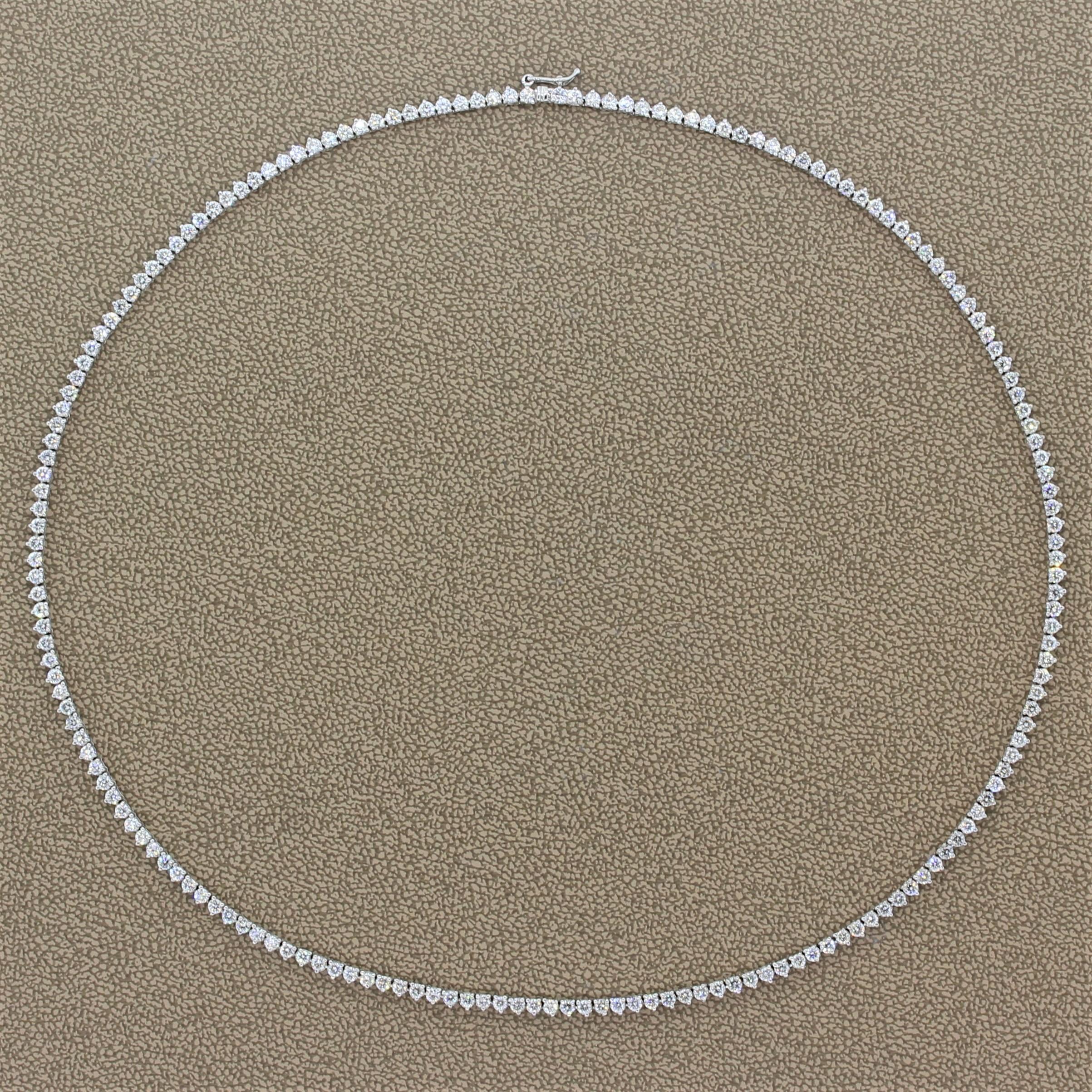 This ever-elegant tennis necklace features 8.52 carats of round cut diamonds. The colorless sparkling diamonds are martini set in 18K white gold. The necklaces box clasp closure and safety latch provide added security.

Necklace Length: 16.75