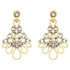 Boucles d'oreilles torsadées en or et diamants par Elie Top