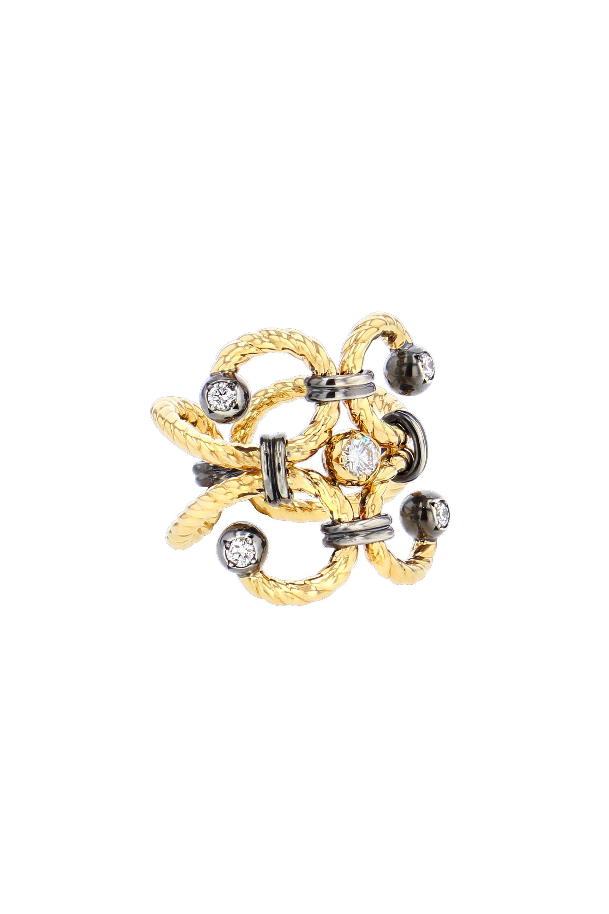 Ring of two yellow gold serpentine twists punctuated with a ball of gold and distressed silver and set with a diamond held by a set of distressed silver rings.

Details:
GVS Diamonds: 0.3 cts
18k Yellow Gold : 9 g
925 Distressed Silver : 2.30 g
Made