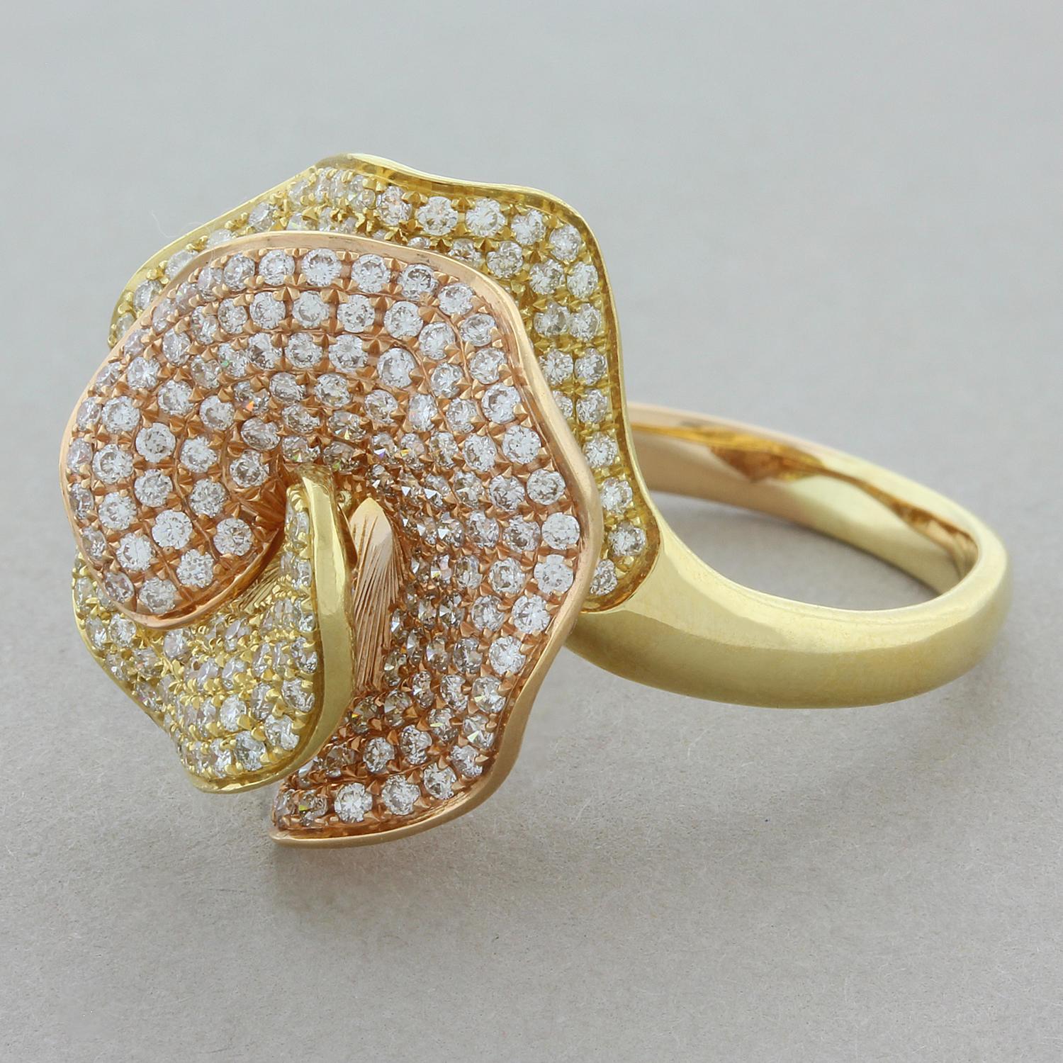 This delicately made flower ring features 1.60 carats of pave set round brilliant cut diamonds. The two flower pedals are made of 18K gold, one in yellow gold and the other in a soft rose gold giving the piece a unique twist.

Ring Size 6.75