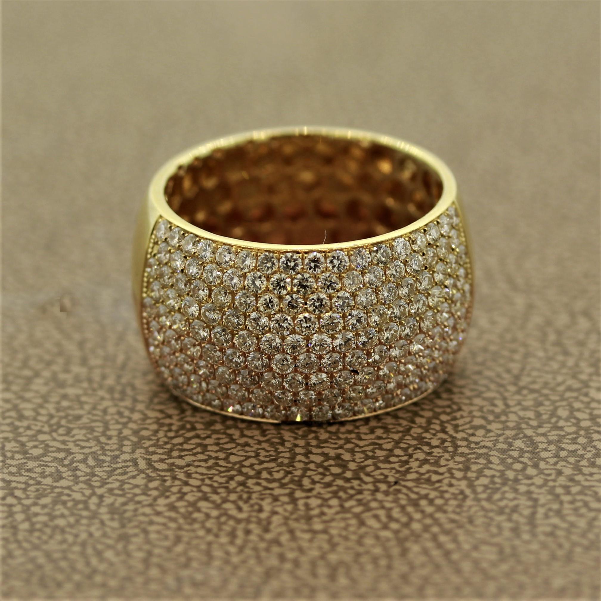 A wide and lovely ring featuring 1.77 carats of round brilliant cut diamonds. The ring is made in 18k gold, half in yellow and the other in rose gold split down the middle. A unique piece that can be worn daily.

Ring Size 7