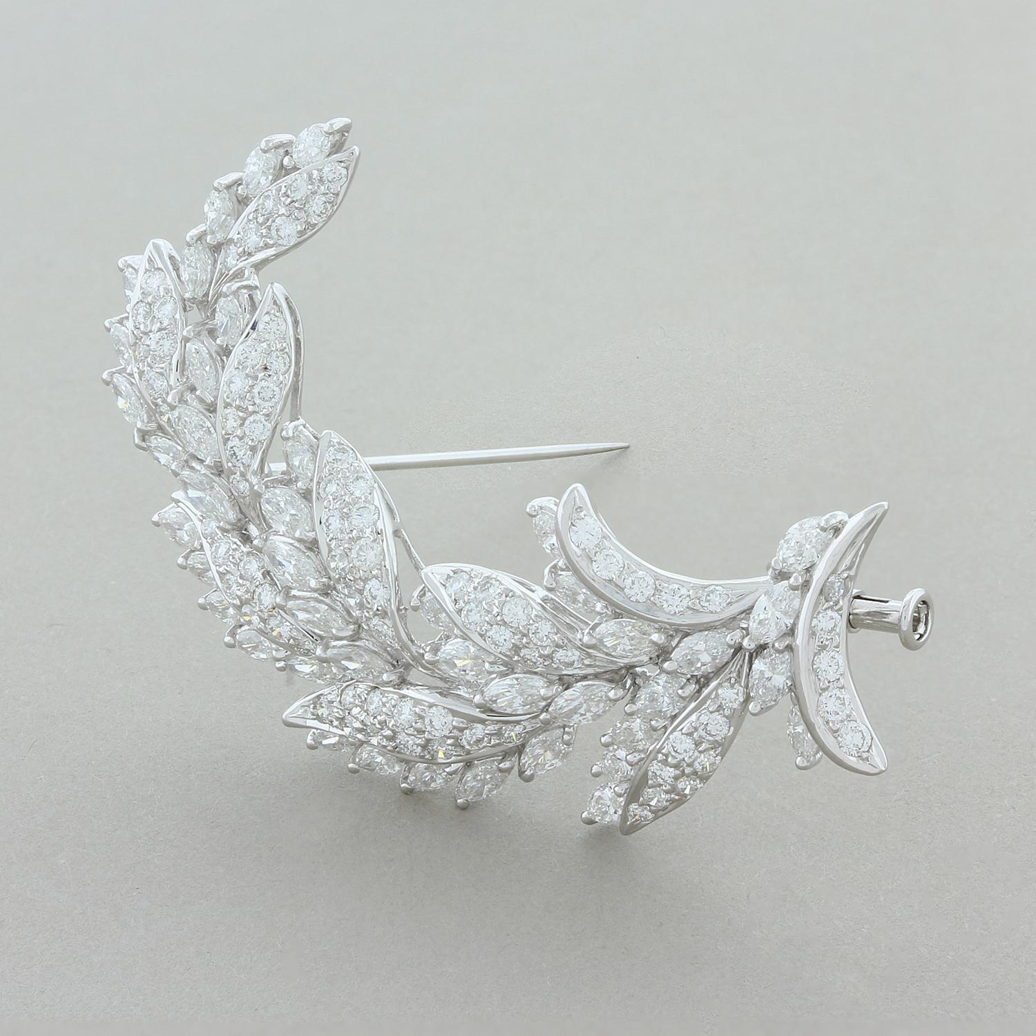 A magnificent brooch featuring 4.98 carats of VS quality marquise and round cut diamonds creating a stalk of wheat. Set in 18K white gold, the brooch curves up in design giving the piece a life-like look.

Brooch Length: 2.00 inches
Brooch Width:
