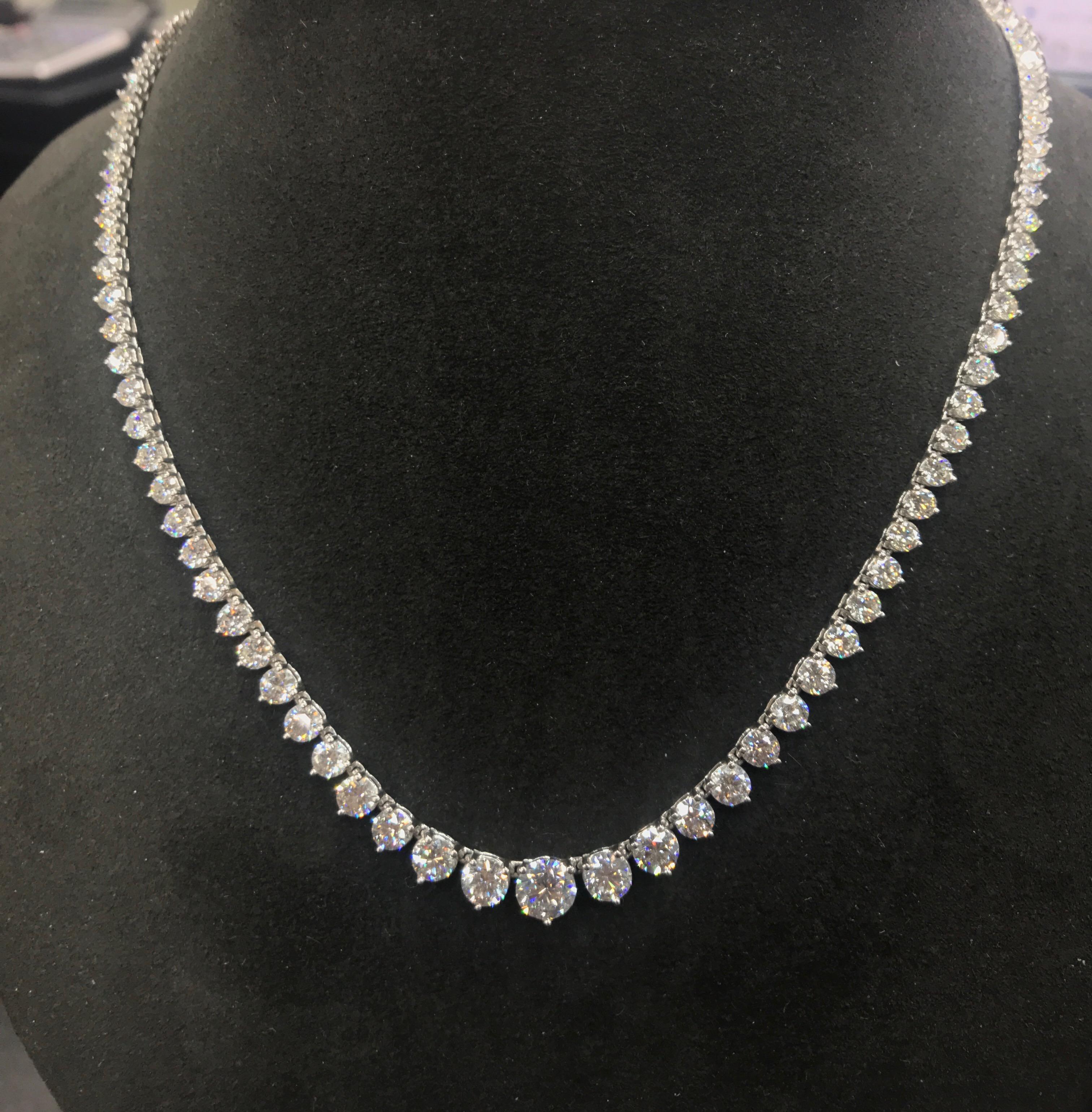 This  necklace features a Gia center stone H Color SI Clarity 1.06 Cts.
It has 109 Diamonds perfectly matched to the center stone , for a total weight of 15 Carats
the gold is 18K
17