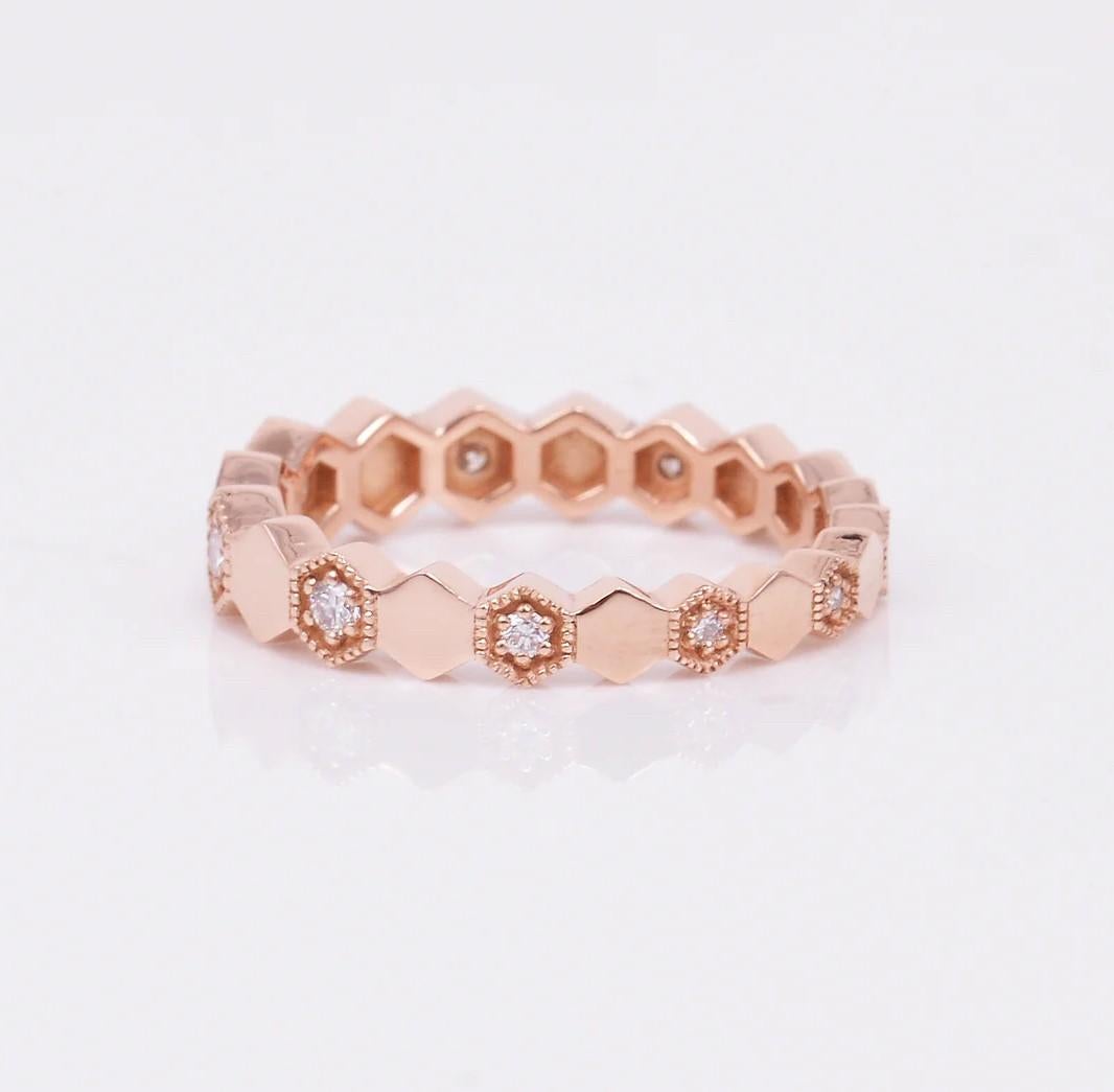 A truly remarkable eternity band that graduates in size all around with alternating diamonds, a total of .21 carats of diamonds set in 14k rose gold. This band looks amazing when worn separately or stacked with other bands! Ring size is a