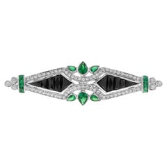 Broche de oro blanco de 14 quilates estilo Art Déco con diamantes, esmeralda verde y ónice negro
