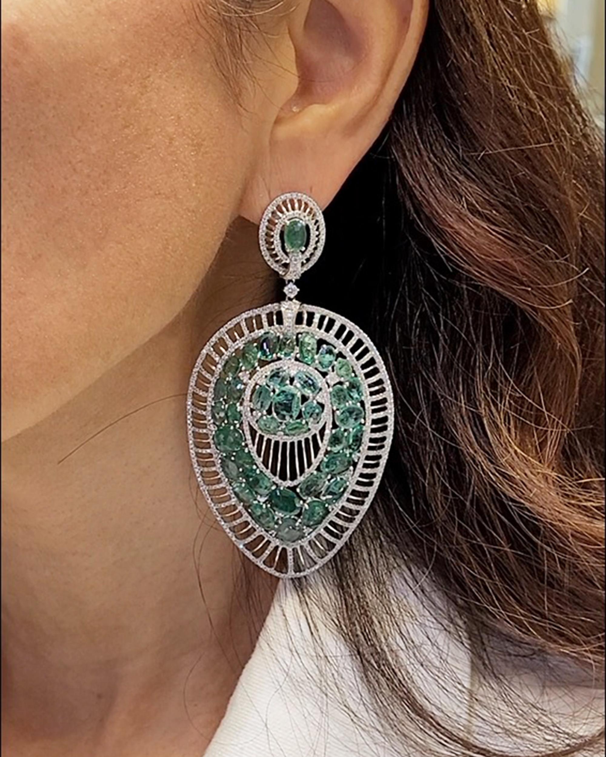 A pair of beautiful chandelier earrings comprising of emeralds and round diamonds.
Total carat weight of the emeralds is approximately 29.40.
Total carat weight of the diamonds is approximately 5.65..
Metal is 18k white gold. Gross weight 46.36