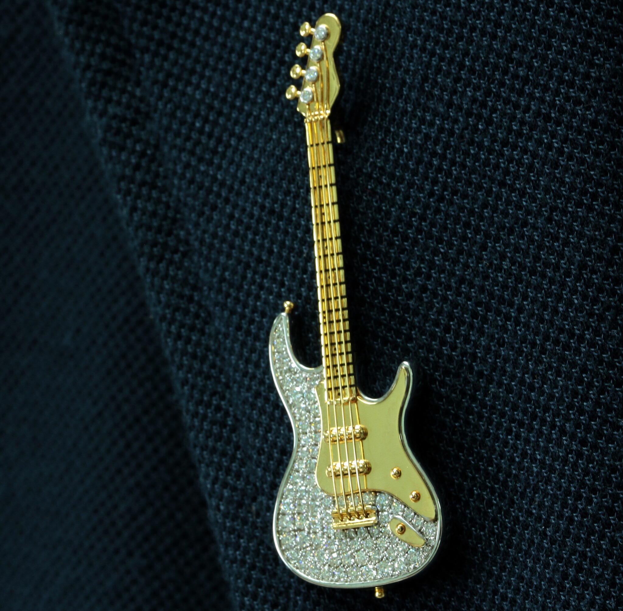 white and gold guitar