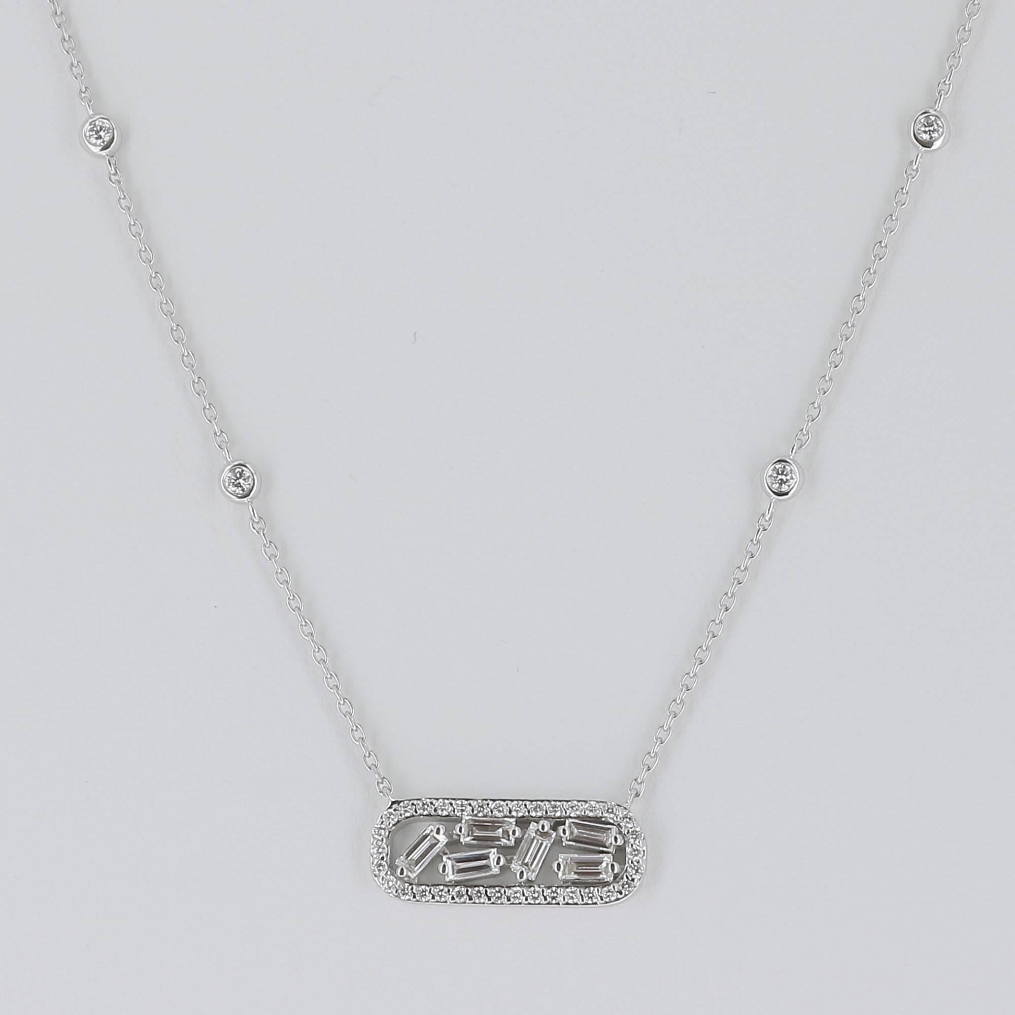 6 baguettes diamonds surrounded by an oval ring set with brilliants
Hanging pendant with a chain adorned with 4 diamonds measuring 43 cm for a total weight of 0.62 carats
The Diamonds quality is GVS
The chain is in 18K White Gold
