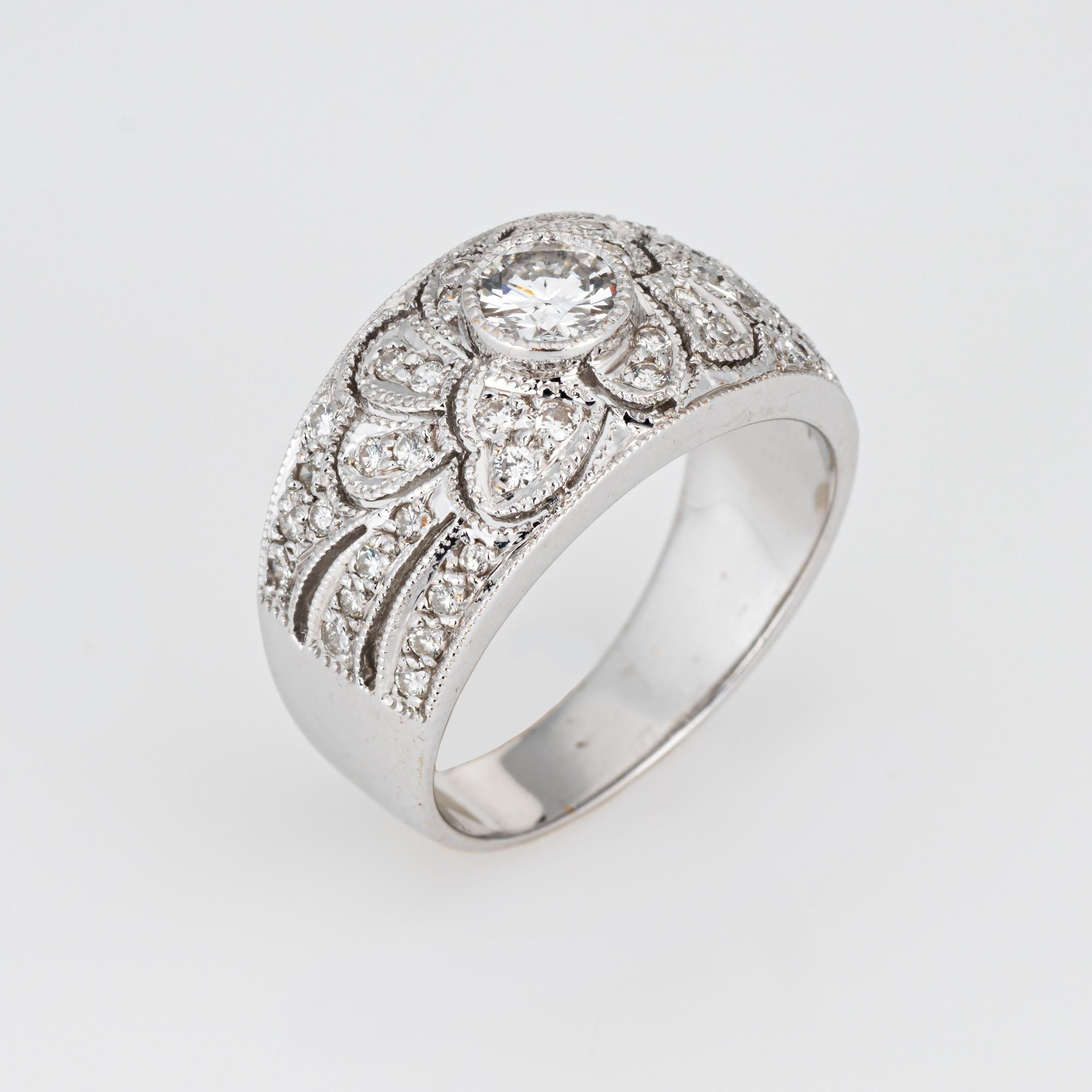 Stylish estate diamond half band crafted in 18 karat white gold. 

Diamonds total an estimated 0.50 carats (estimated at H-I color and SI1-I1 clarity). 

Set with shimmering diamonds in a scrolled pattern, the ring makes a statement! The wide band
